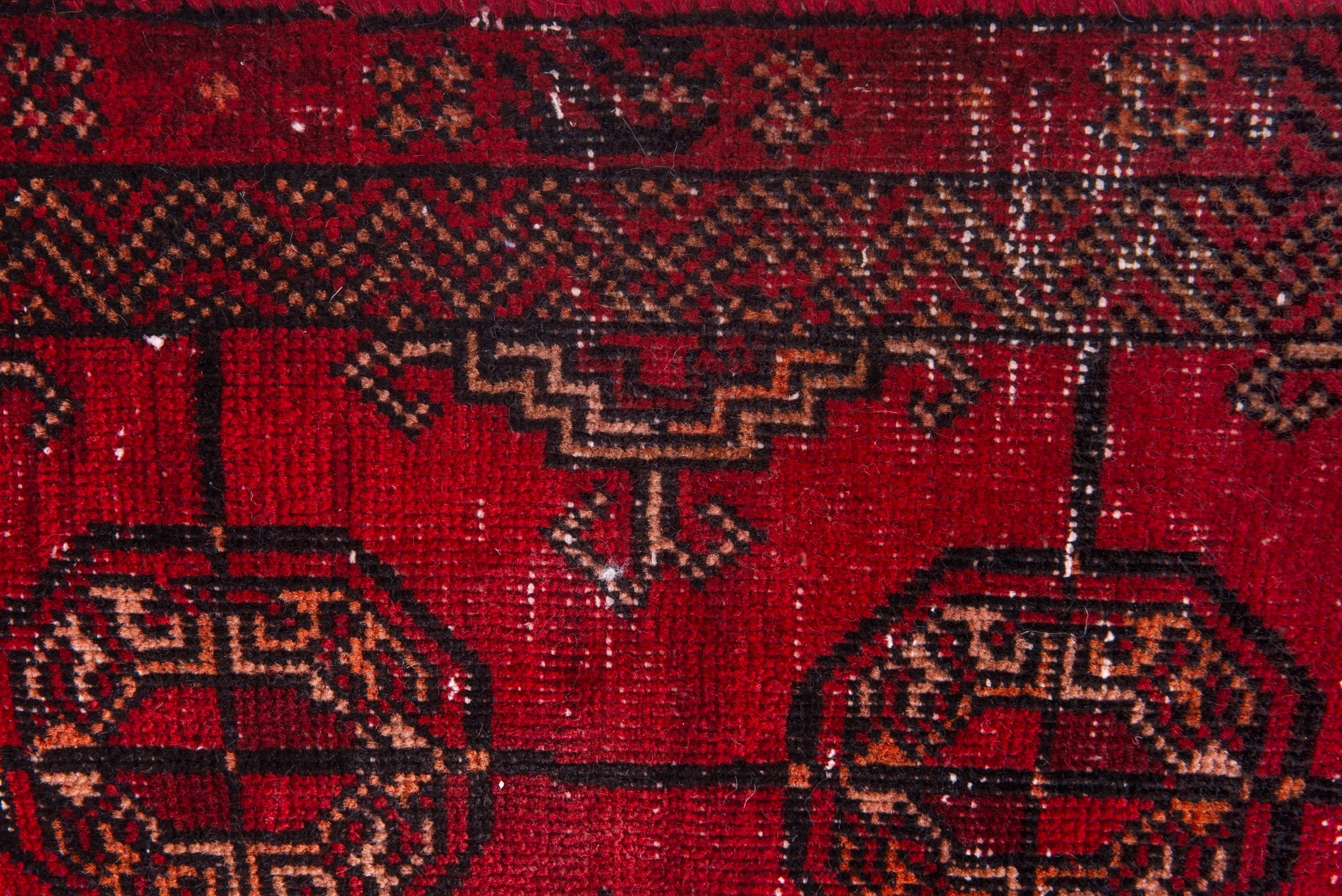 Persian Baluch runner rug in deep red and rust, view 13 of 17