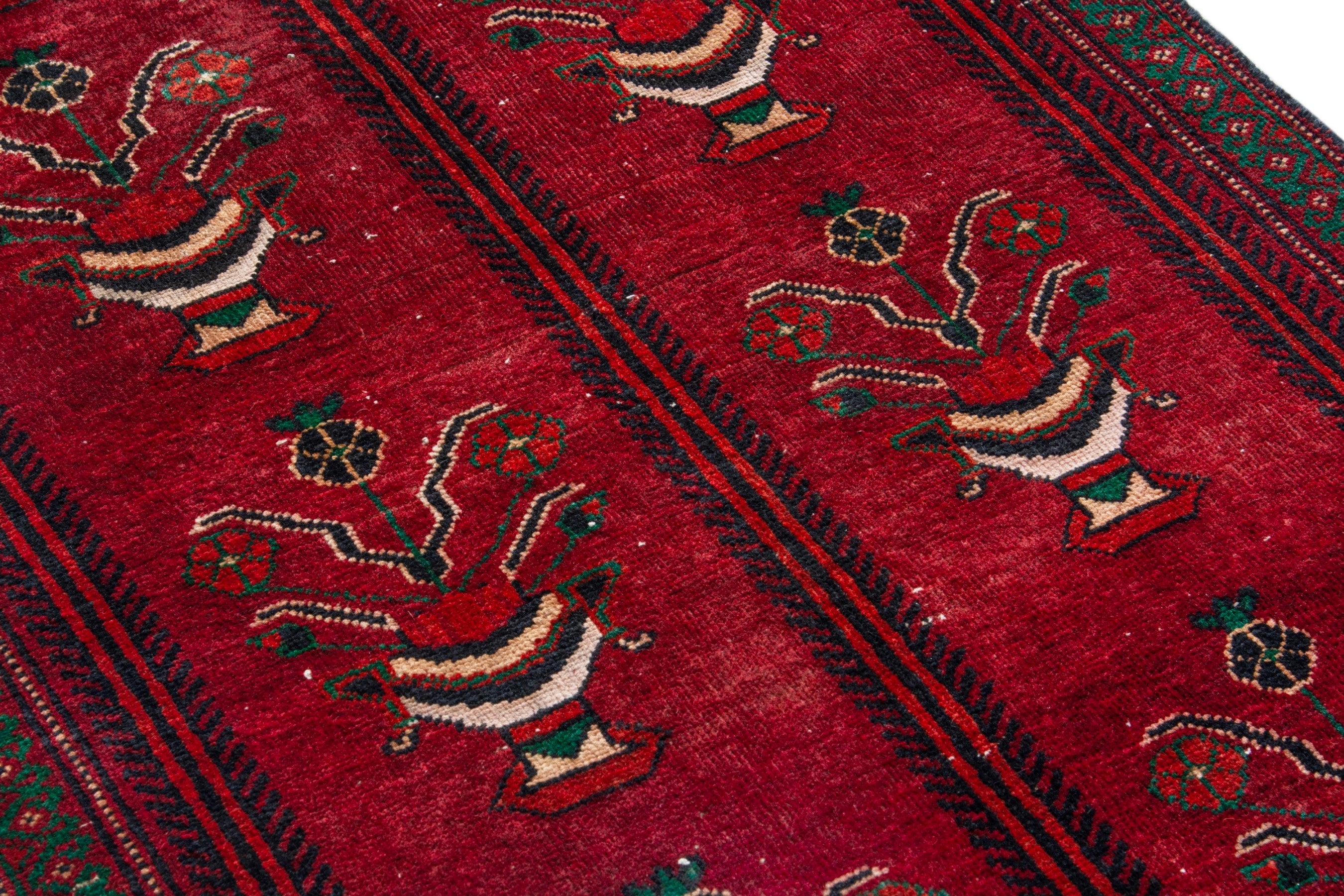 Persian Baluch accent rug in deep red and dark brown, view 9 of 16