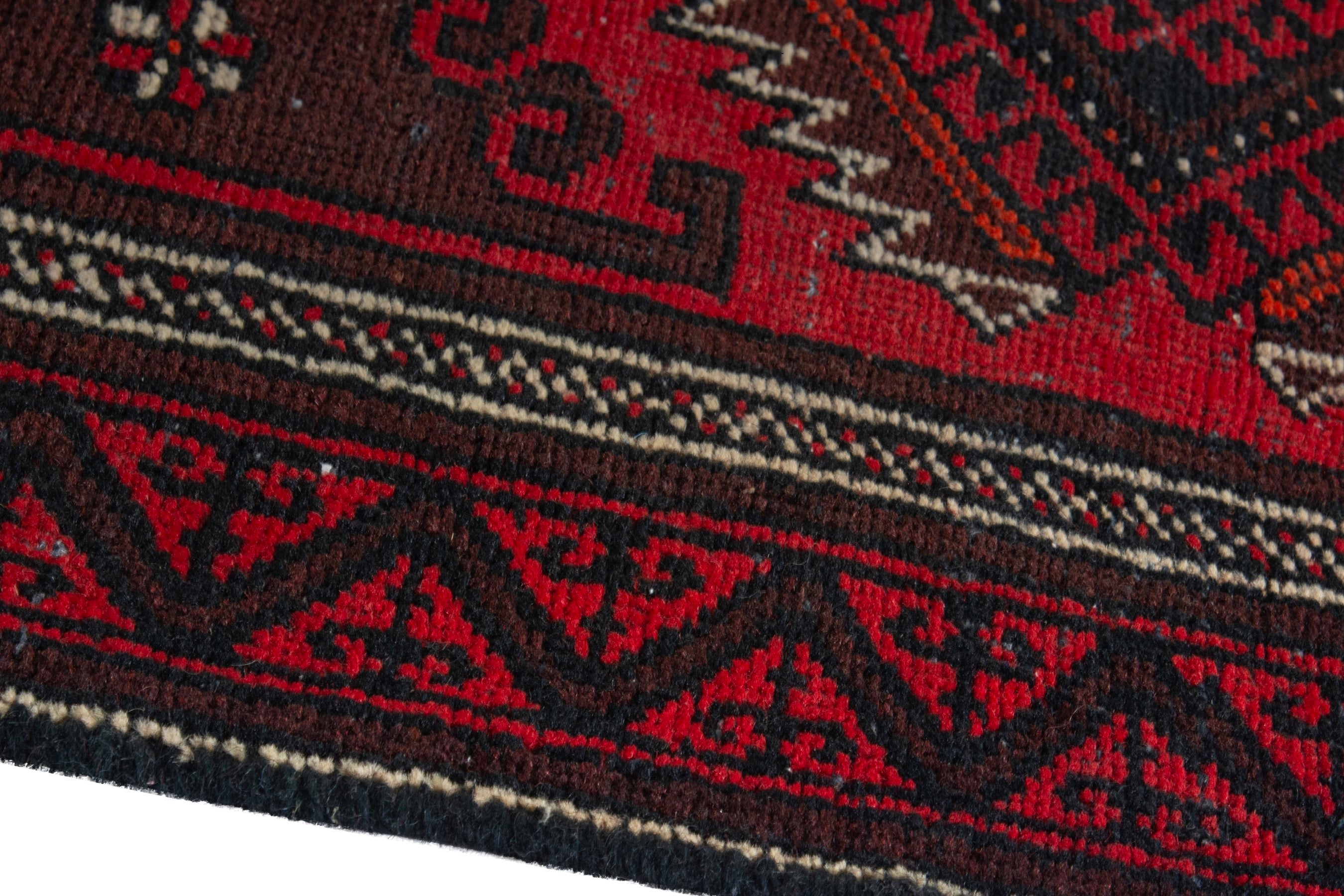 Persian Baluch accent rug in deep red and burgundy, view 8 of 17