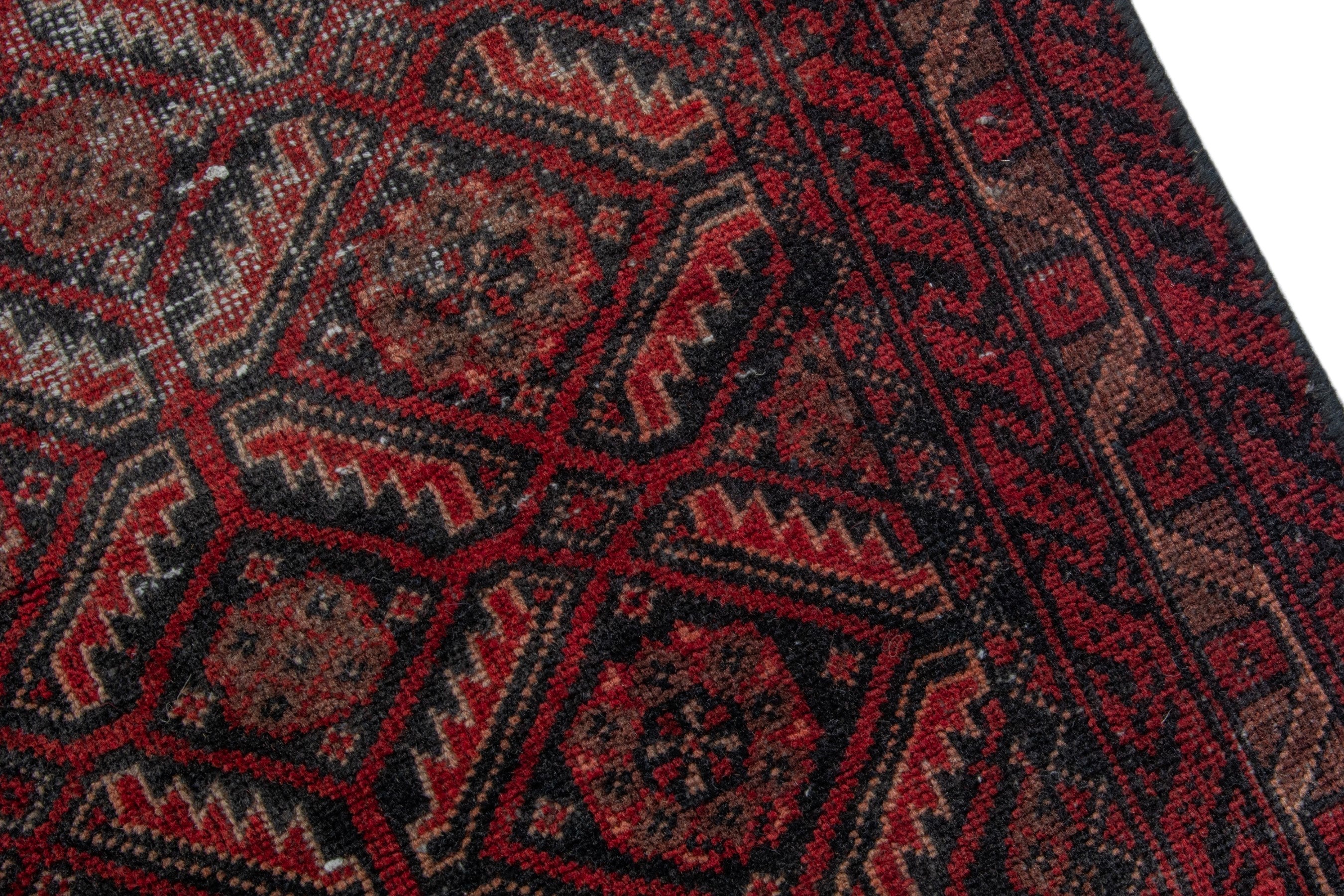 Persian Baluch accent rug in burgundy and deep red, view 7 of 16