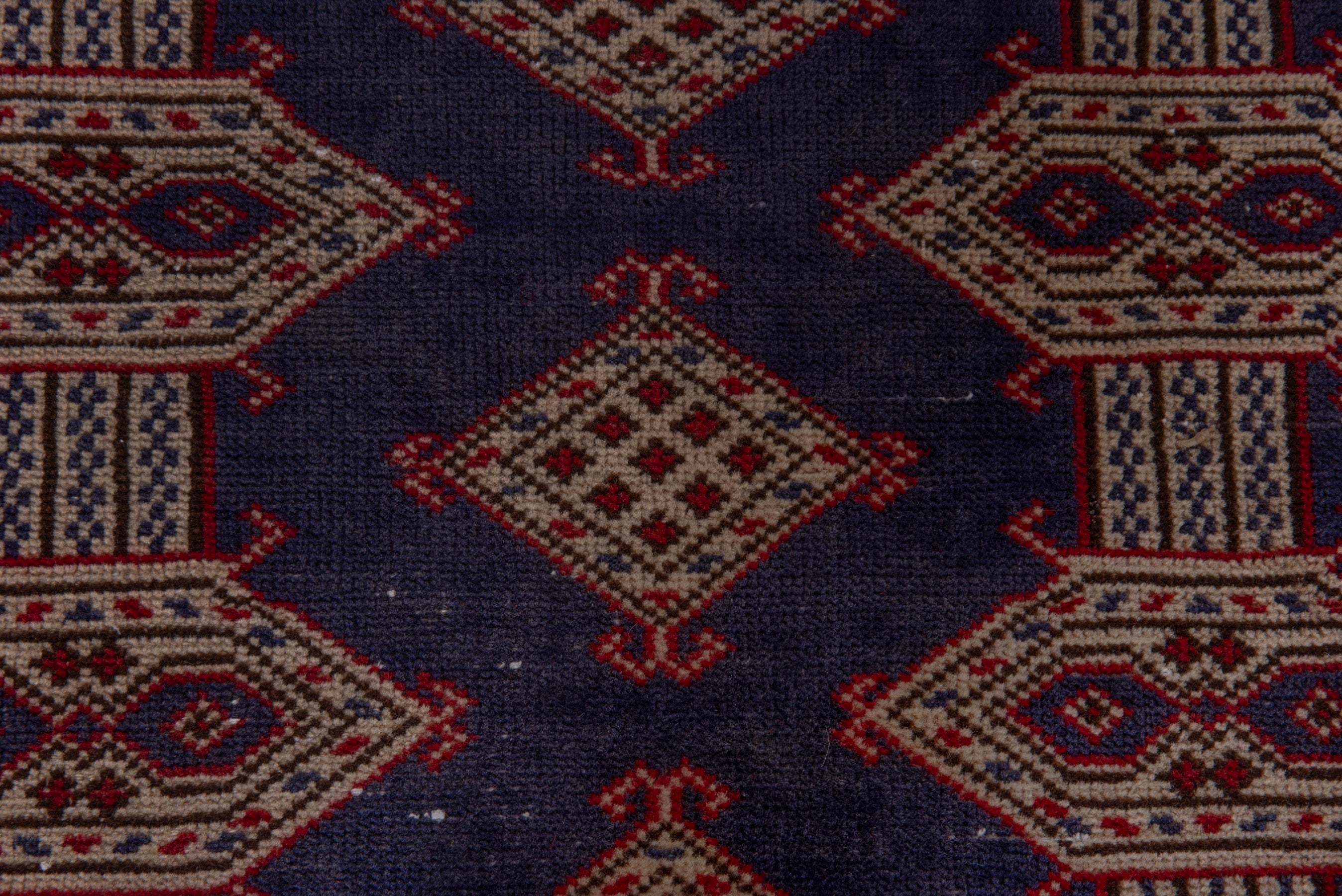 Persian Torkaman accent rug in navy and tan, view 13 of 17