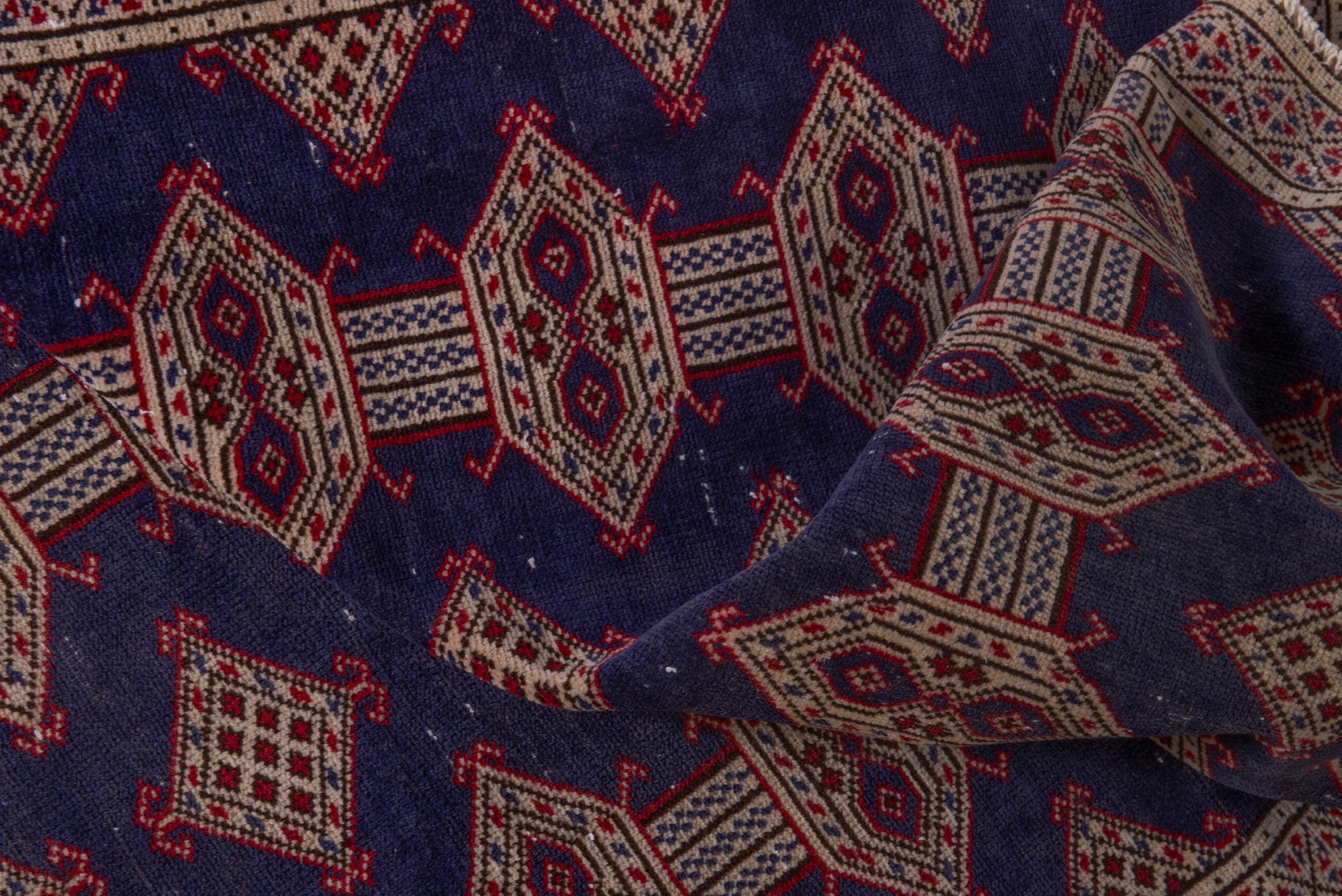 Persian Torkaman accent rug in navy and tan, view 16 of 17
