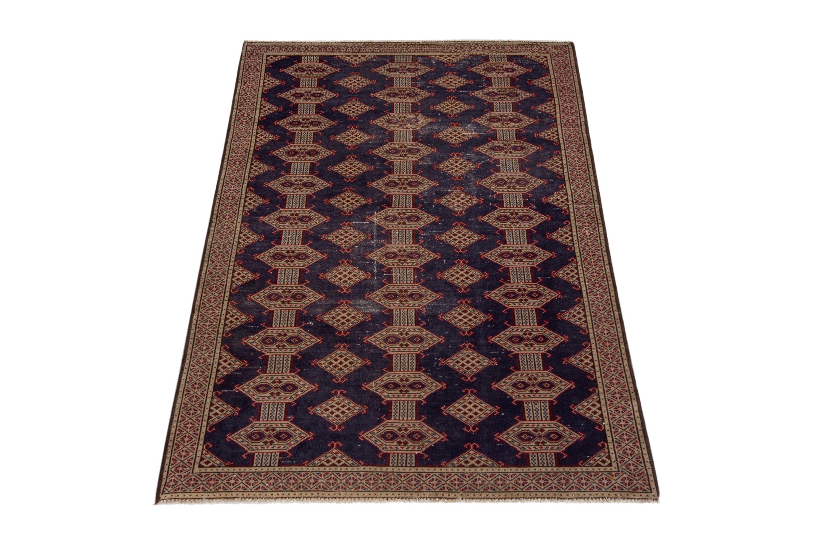 Persian Torkaman accent rug in navy and tan, view 2 of 17