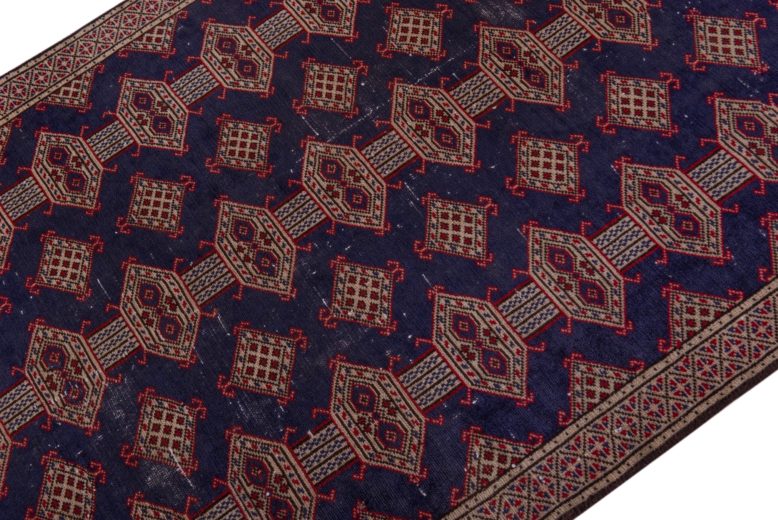 Persian Torkaman accent rug in navy and tan, view 4 of 17