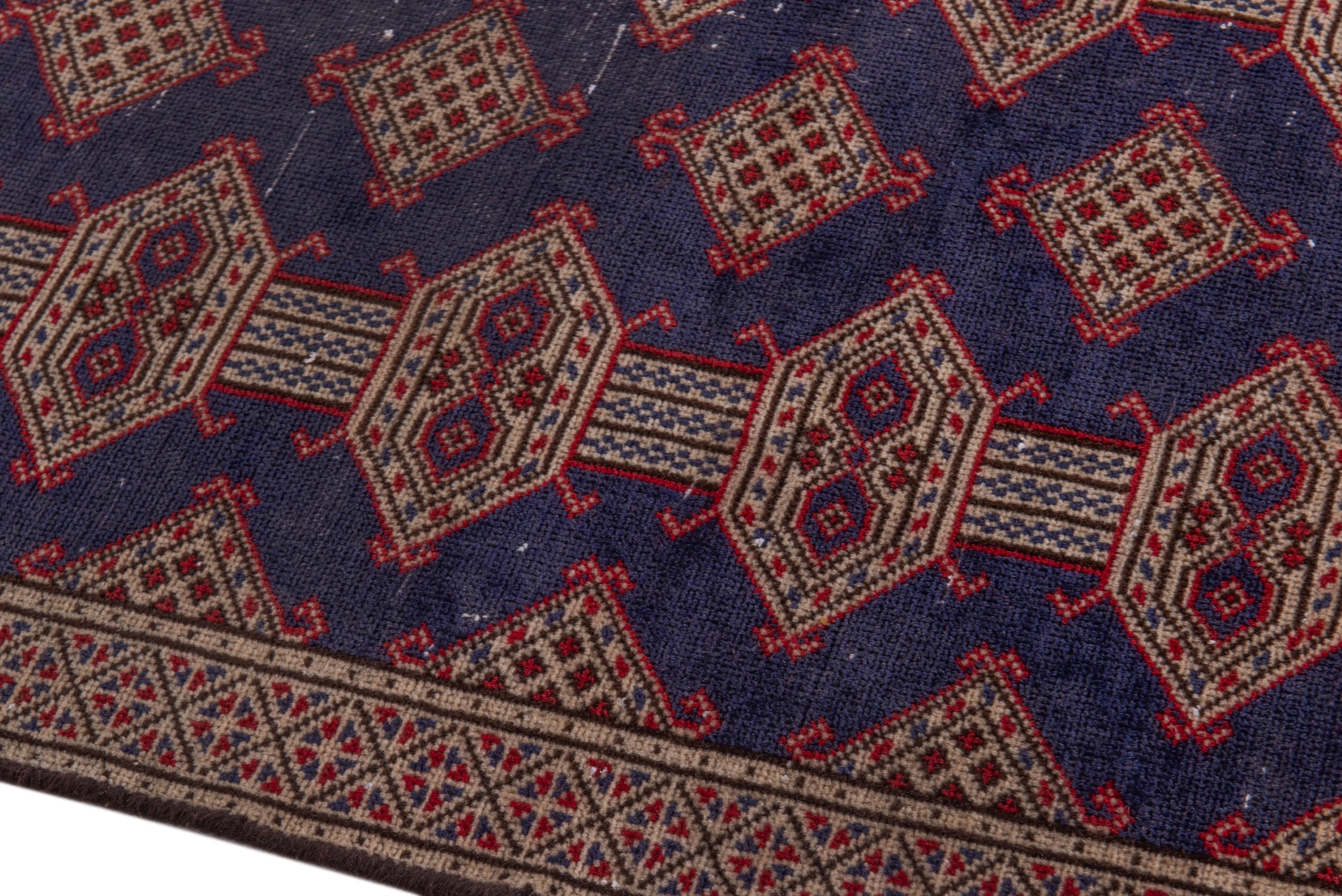 Persian Torkaman accent rug in navy and tan, view 8 of 17