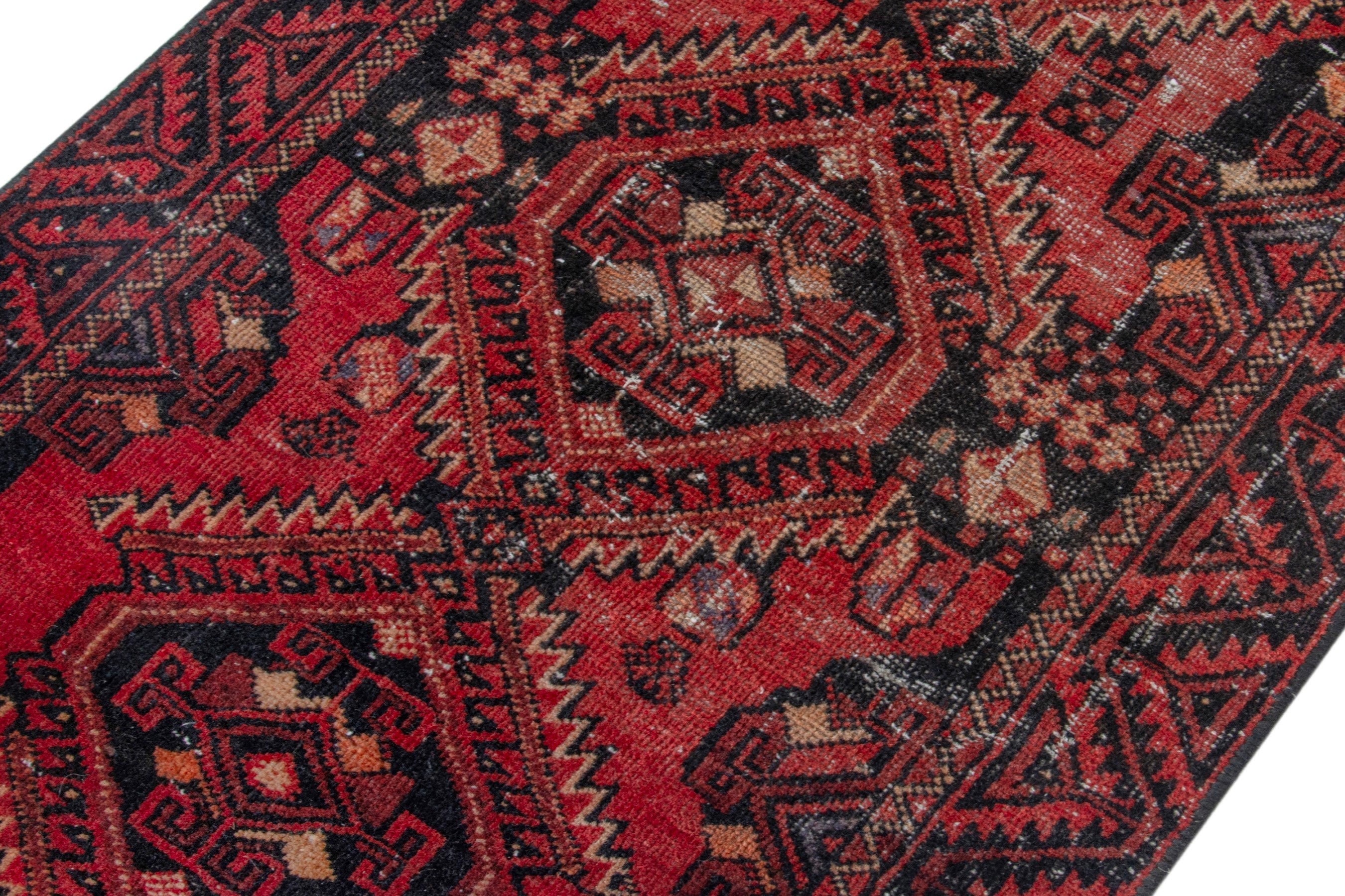 Persian Baluch accent rug in deep red and burgundy, view 4 of 17