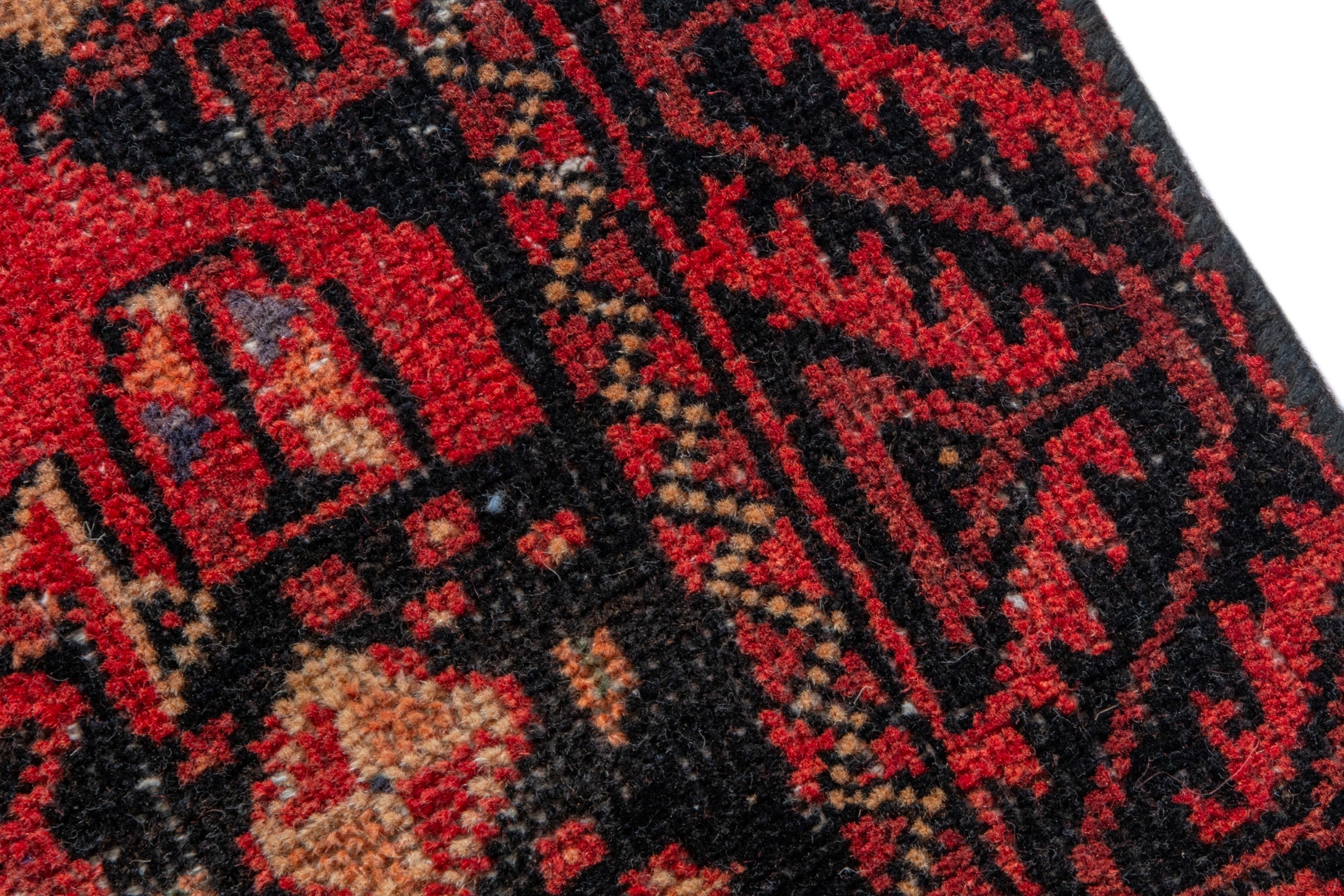 Persian Baluch accent rug in deep red and burgundy, view 7 of 17