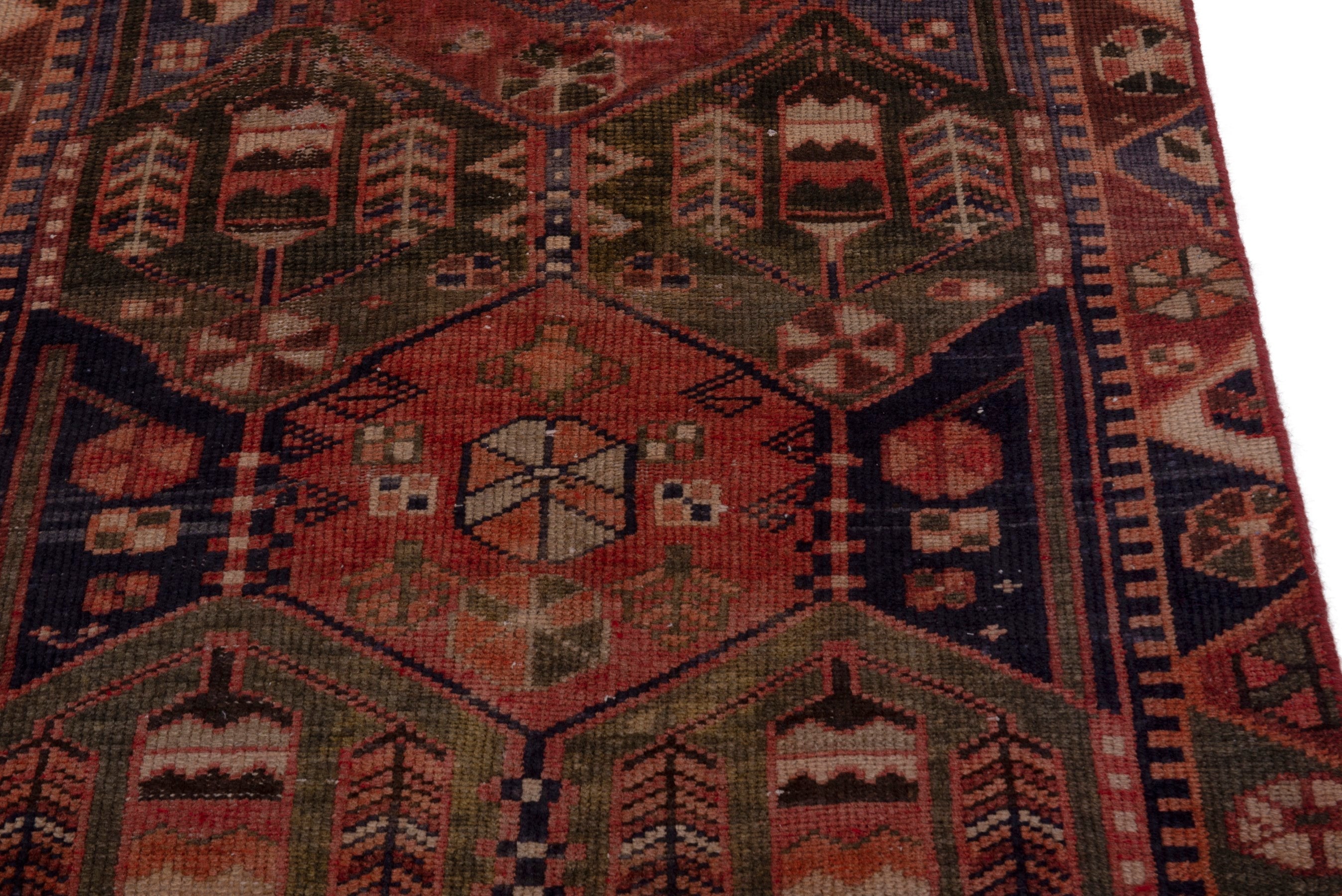 Persian Bakhtiari accent rug in navy and rust, view 7 of 18