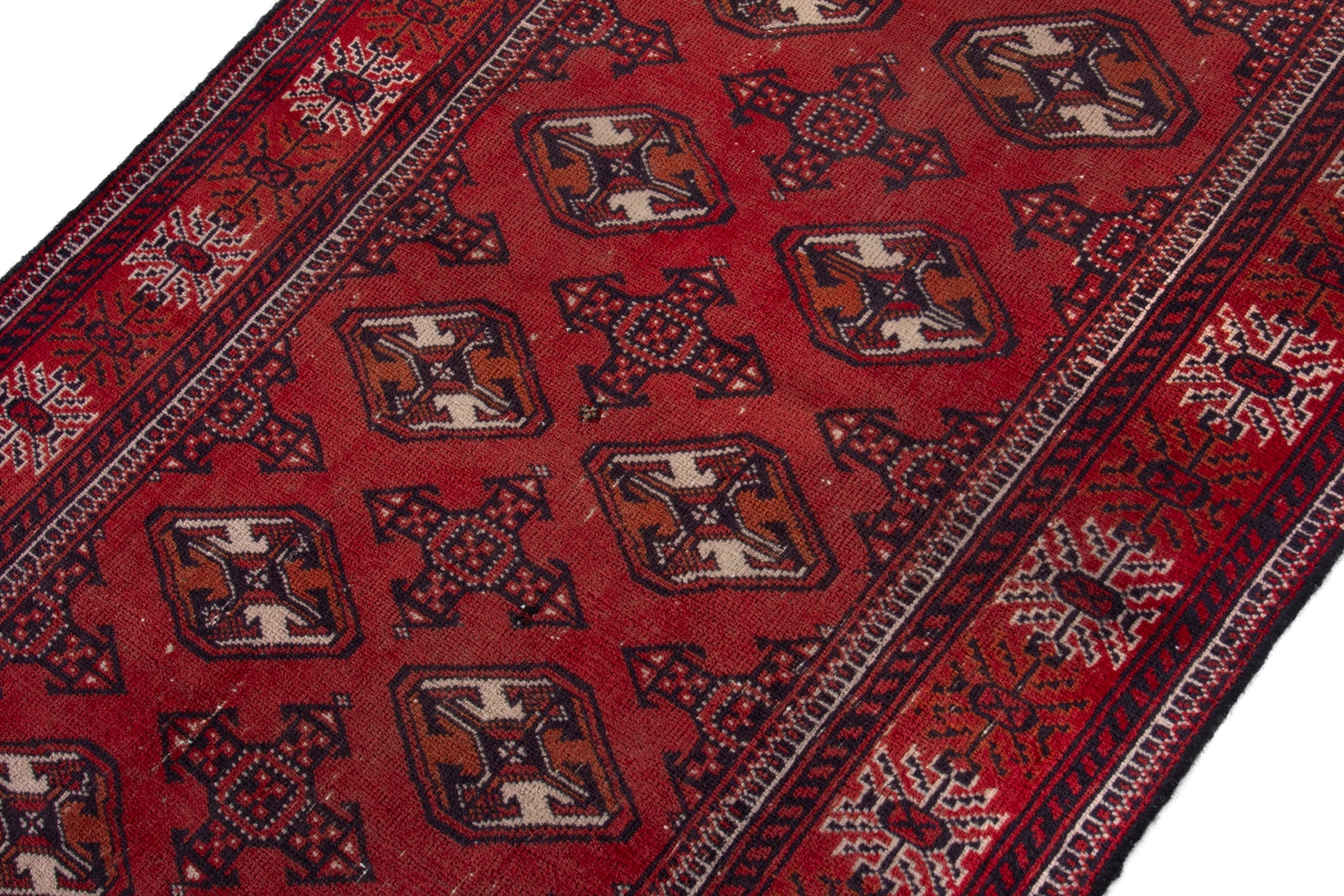 Persian Torkaman accent rug in deep red and faded red, view 4 of 18