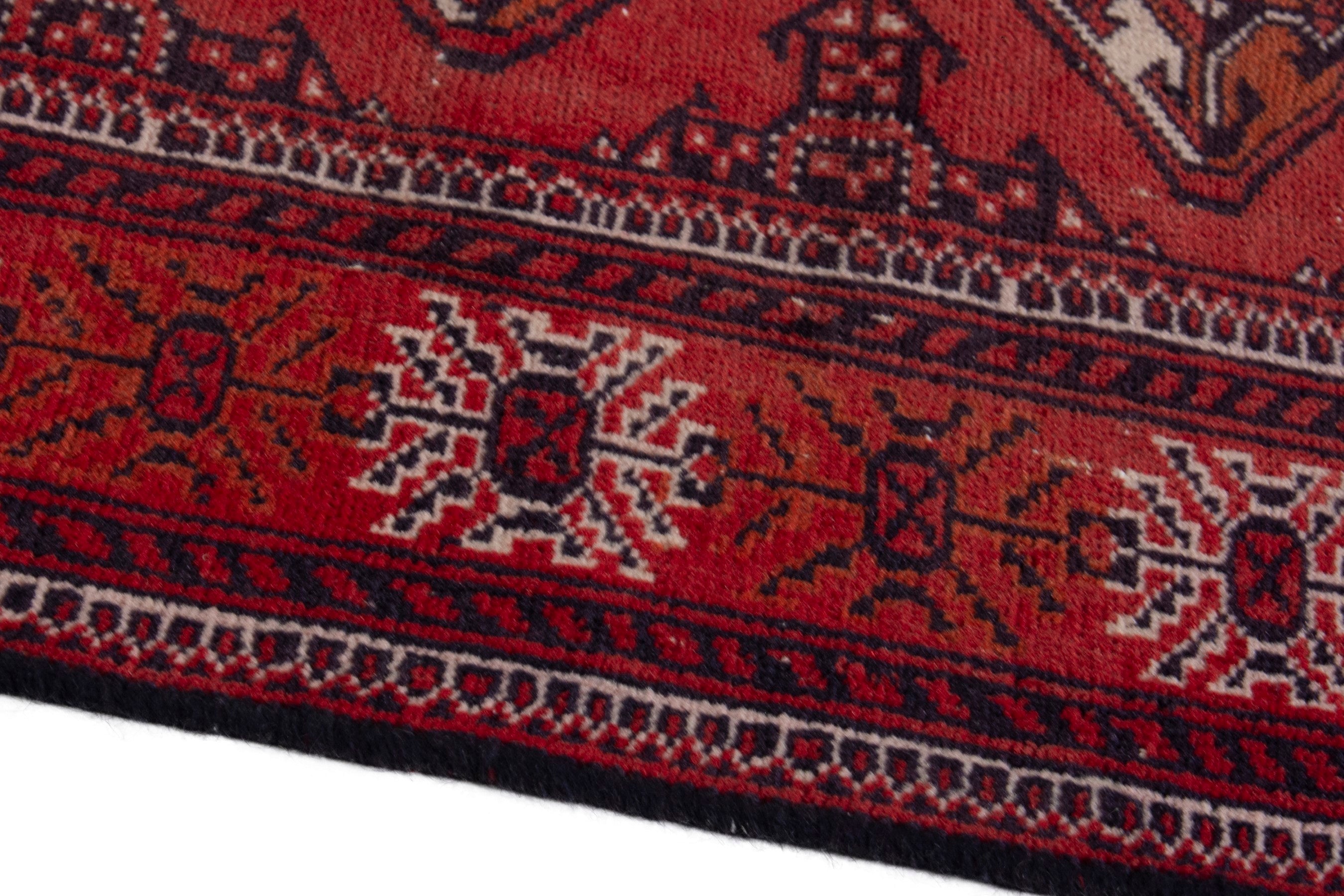 Persian Torkaman accent rug in deep red and faded red, view 8 of 18