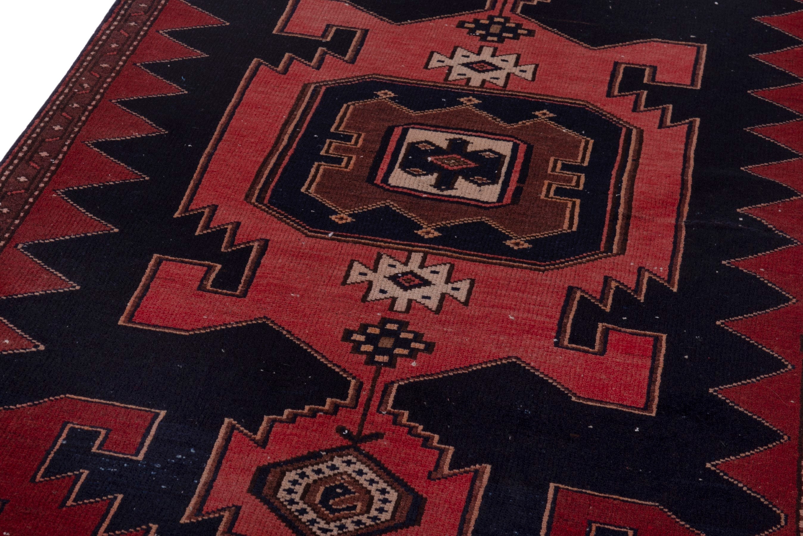 Persian Saveh accent rug in deep red and black, view 9 of 18