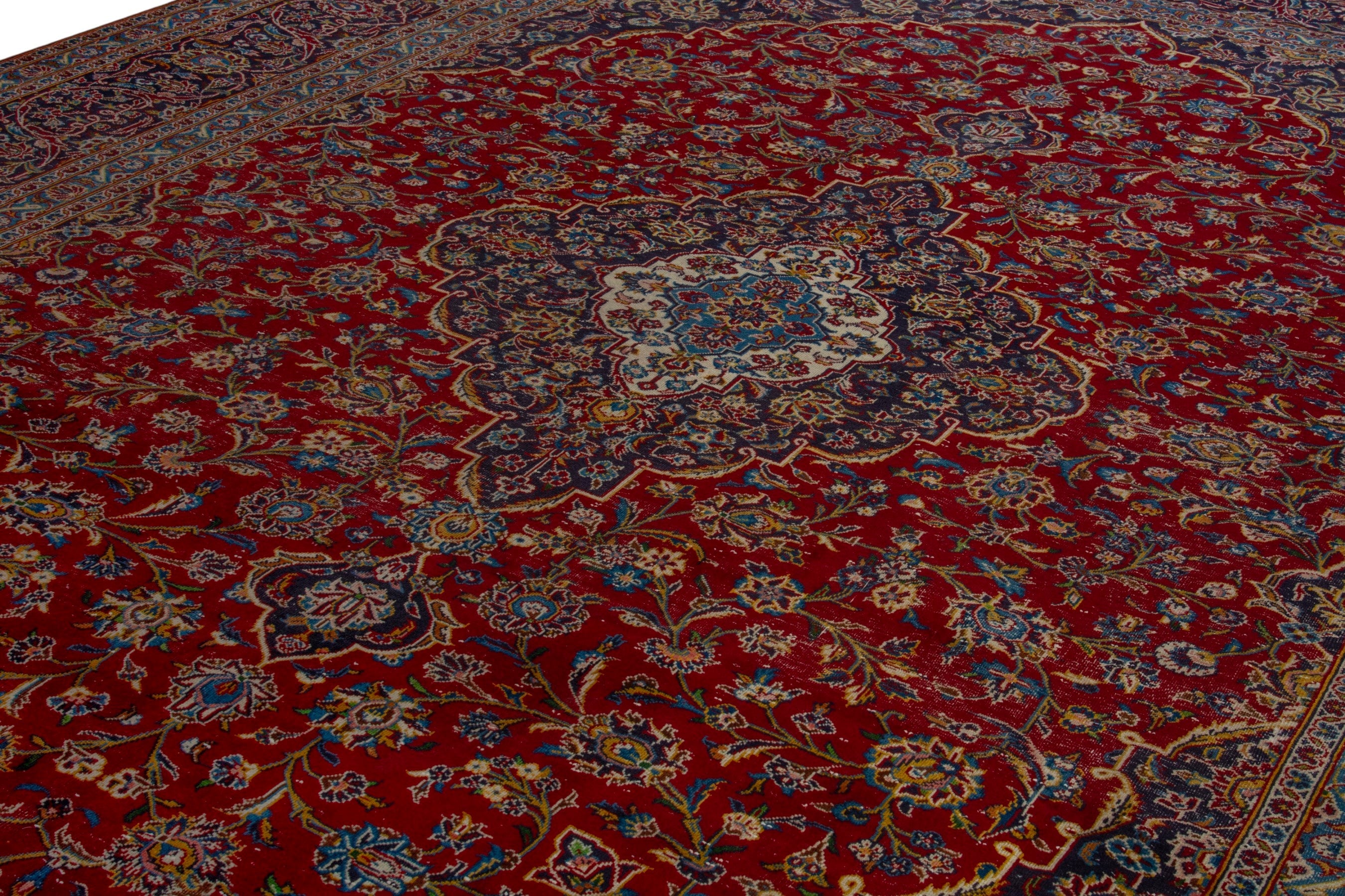 Persian Kashan oversized rug in deep red and dark brown, view 9 of 20