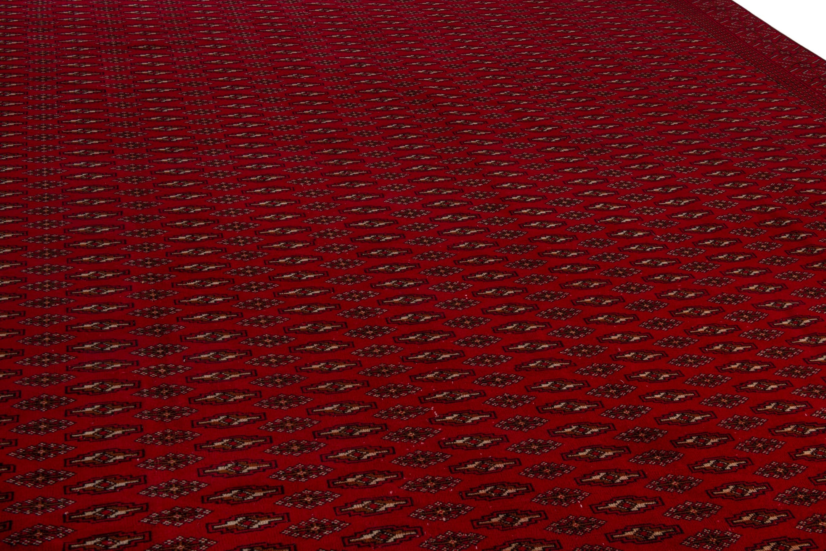 Persian Torkaman oversized rug in burgundy and deep red, view 10 of 20