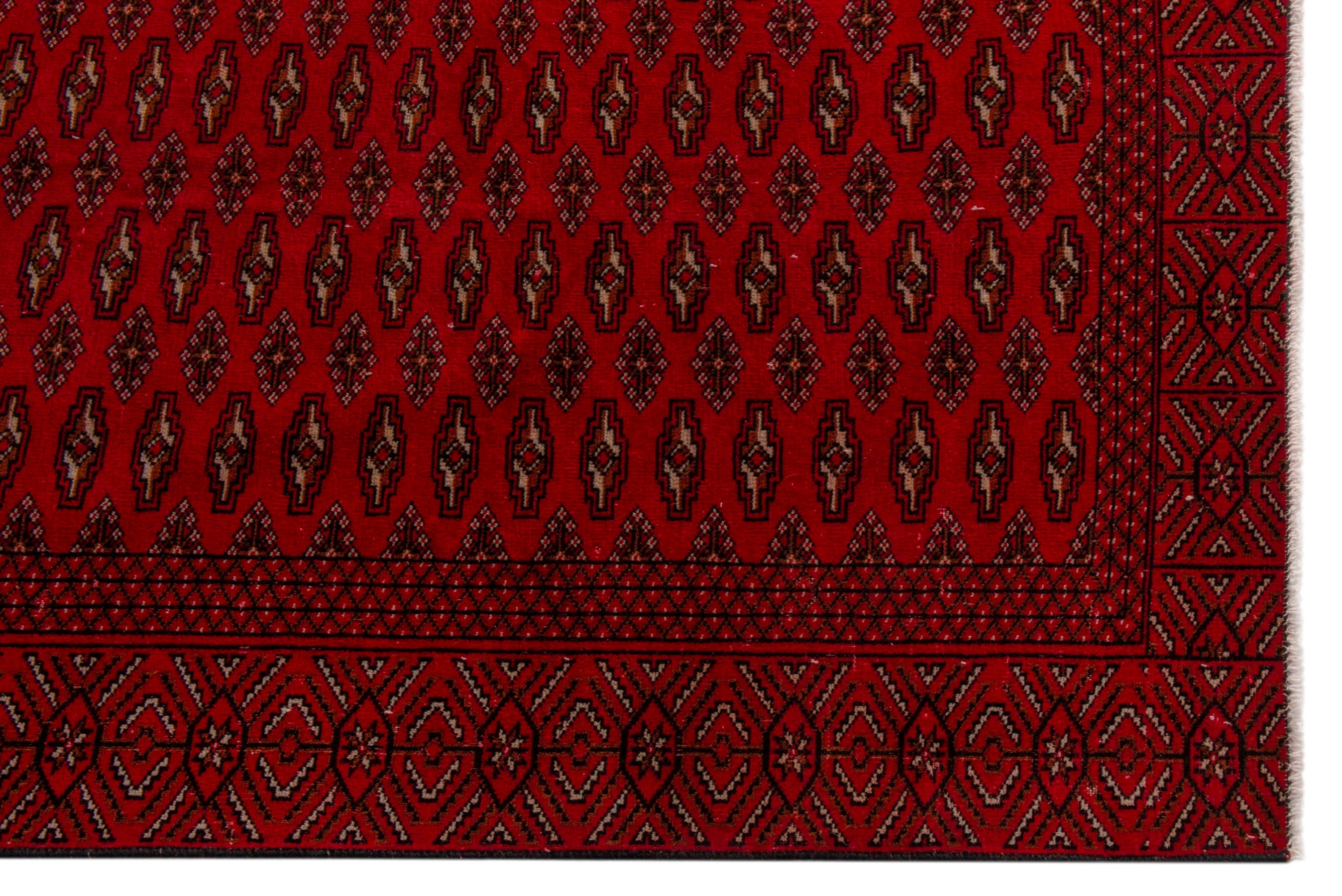 Persian Torkaman oversized rug in burgundy and deep red, view 5 of 20