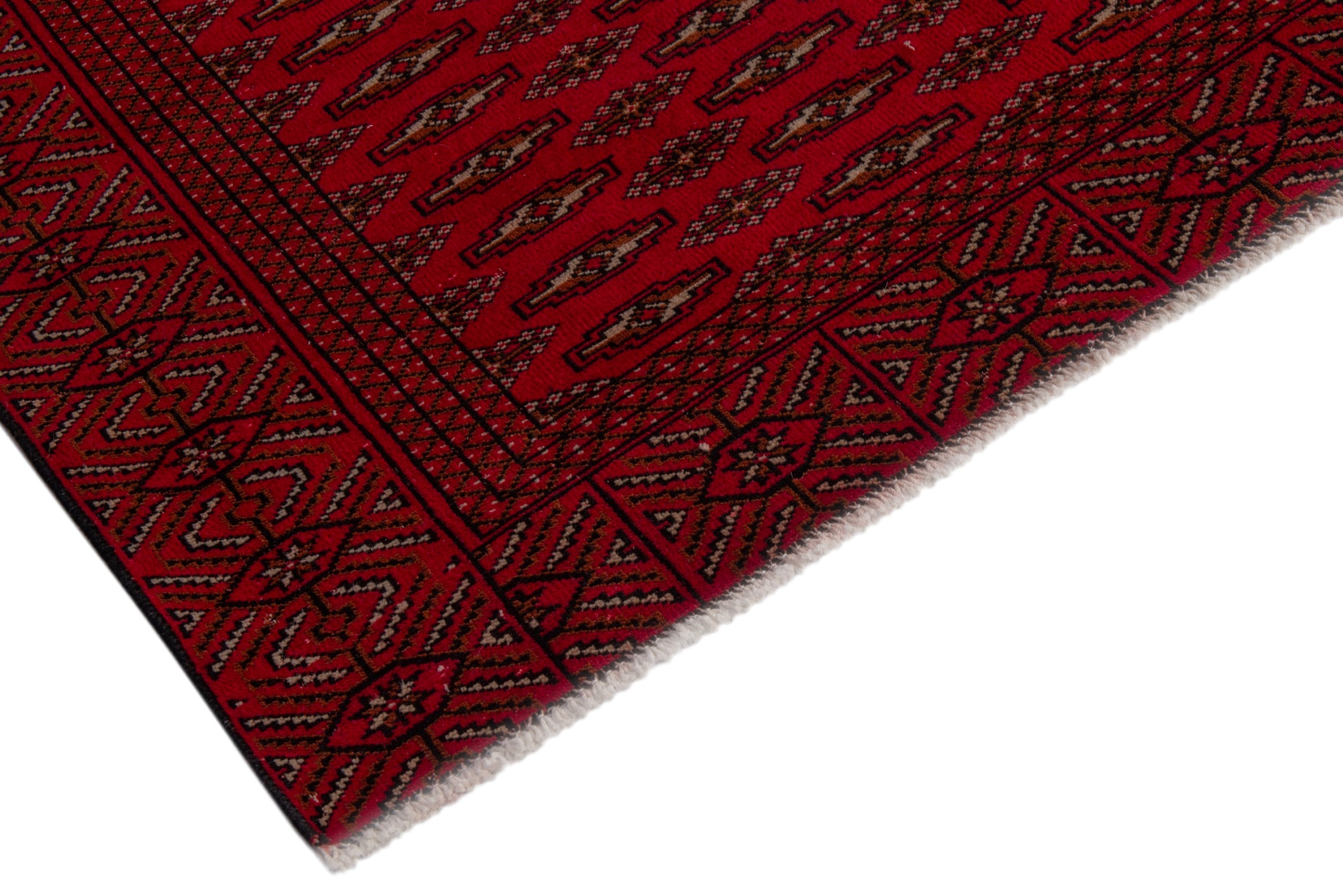 Persian Torkaman oversized rug in burgundy and deep red, view 6 of 20