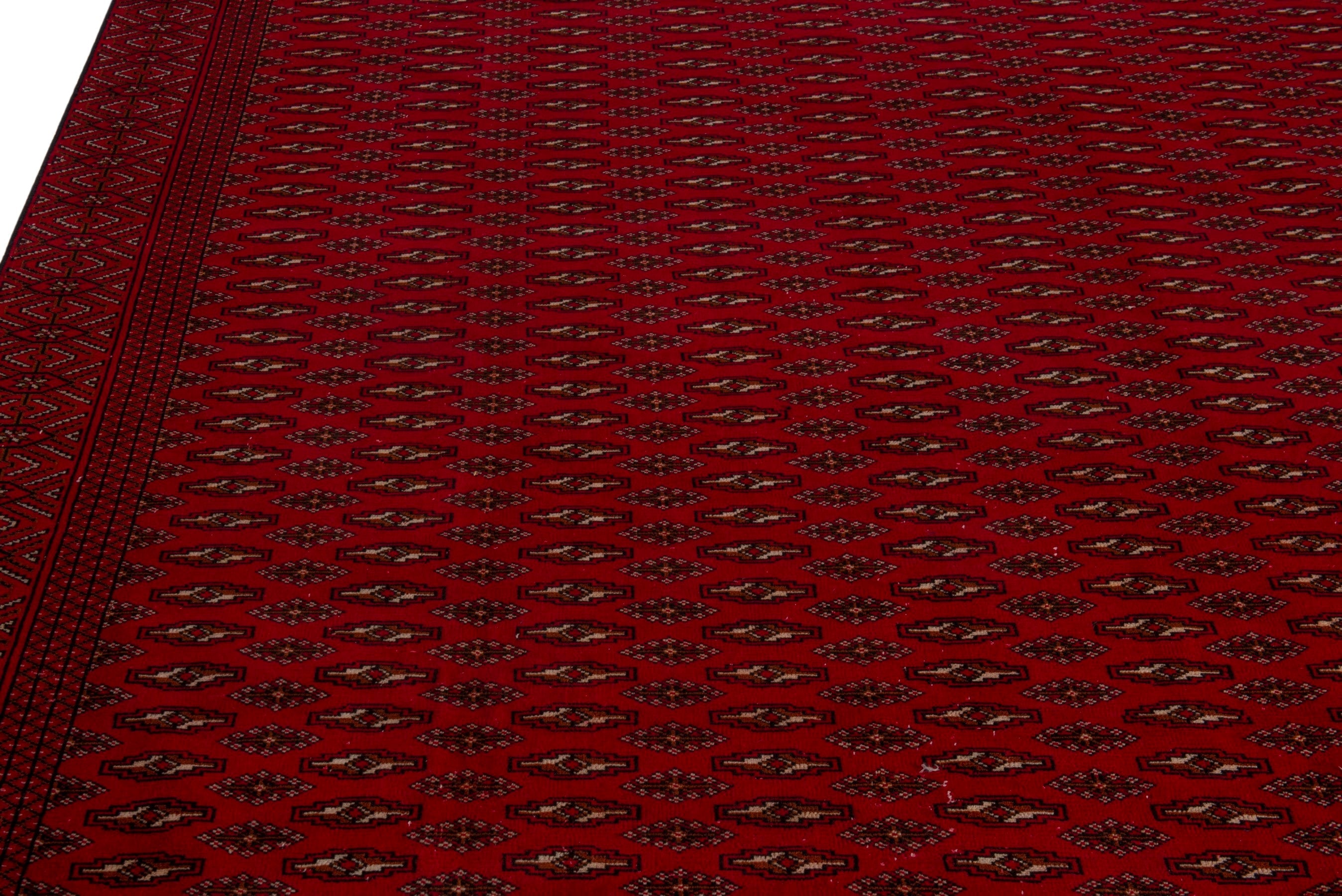 Persian Torkaman oversized rug in burgundy and deep red, view 7 of 20
