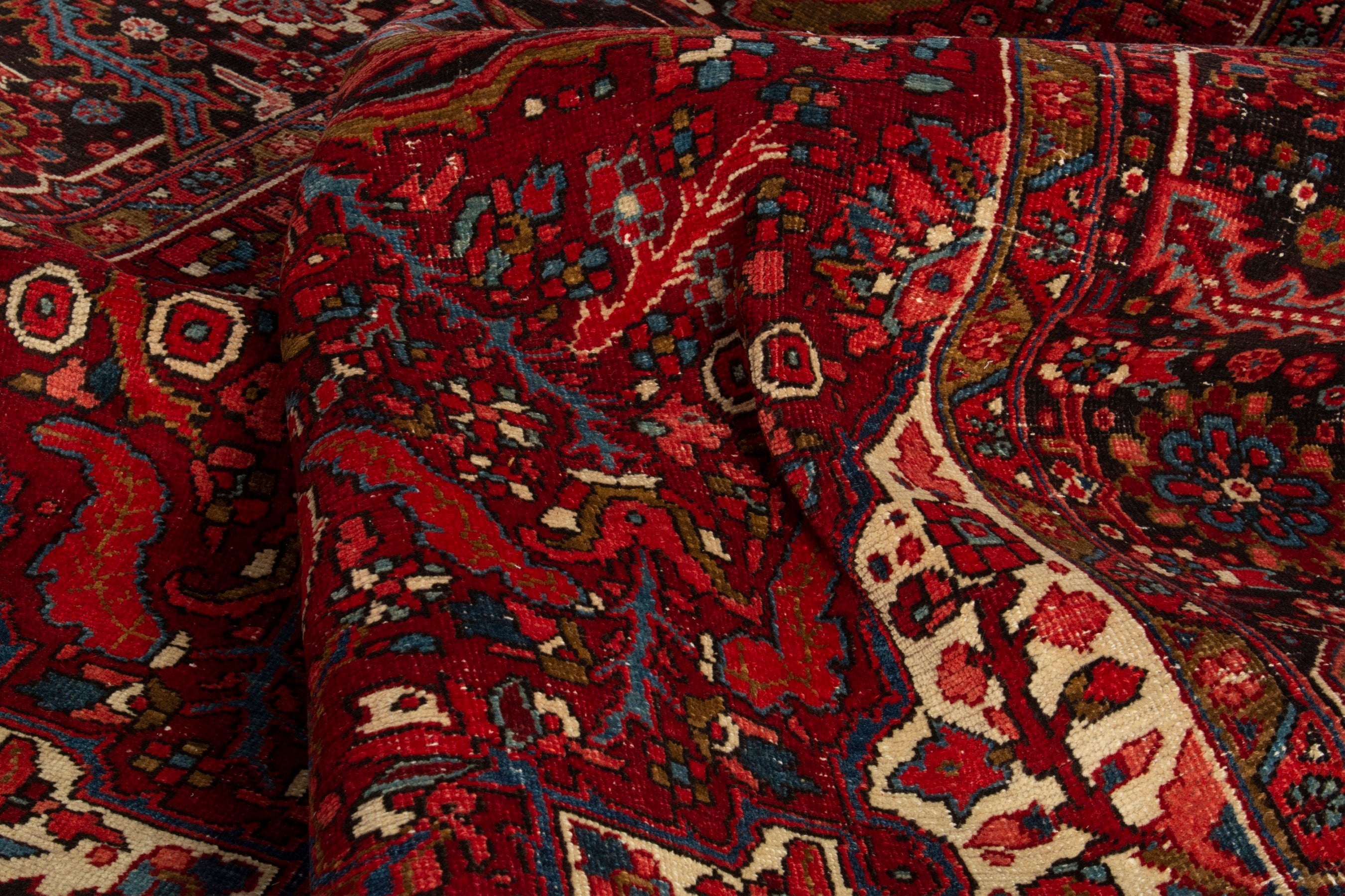 Persian Heriz oversized rug in deep red and burgundy, view 16 of 18