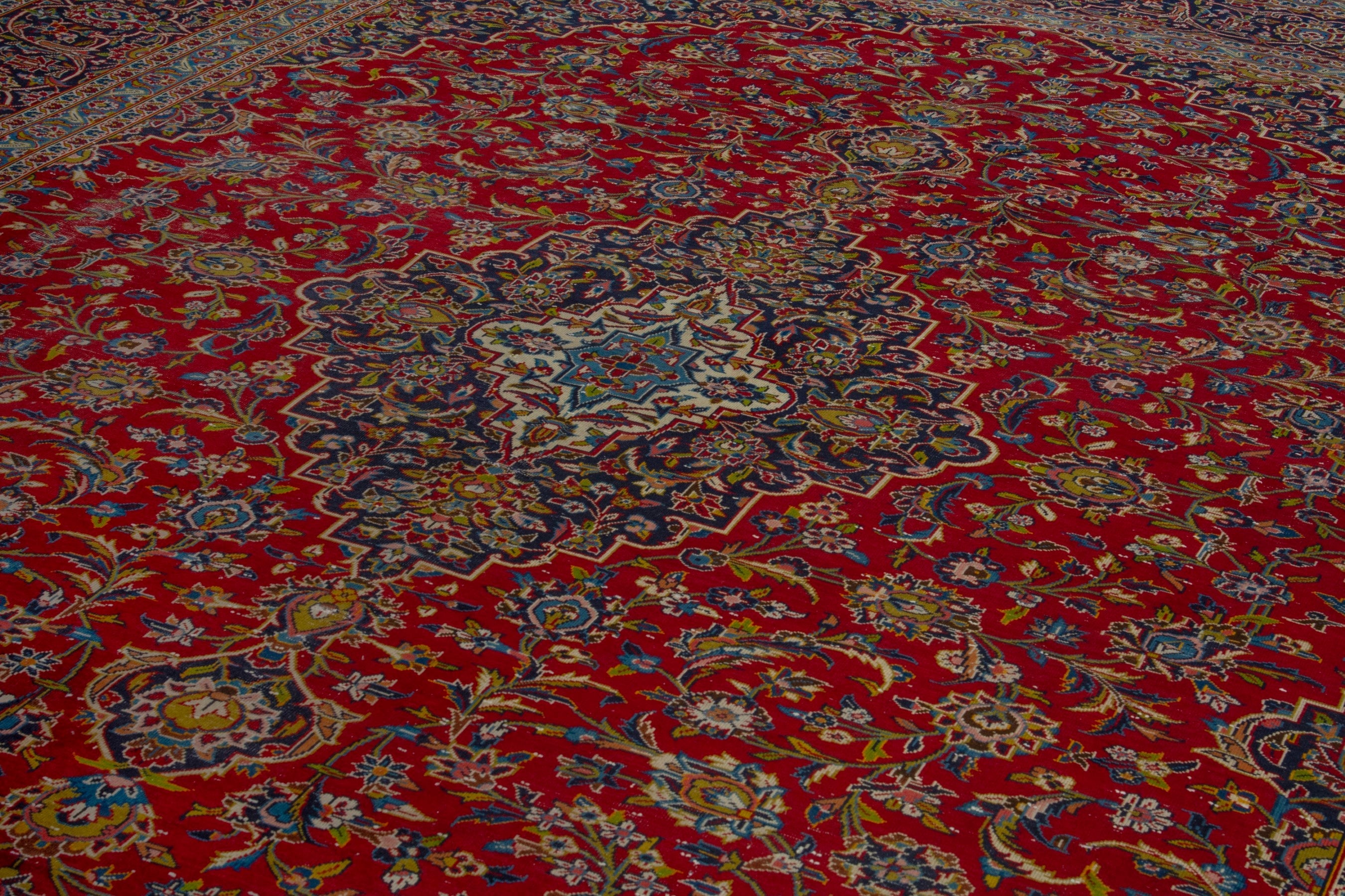 Persian Kashan oversized rug in deep red and brown, view 9 of 22