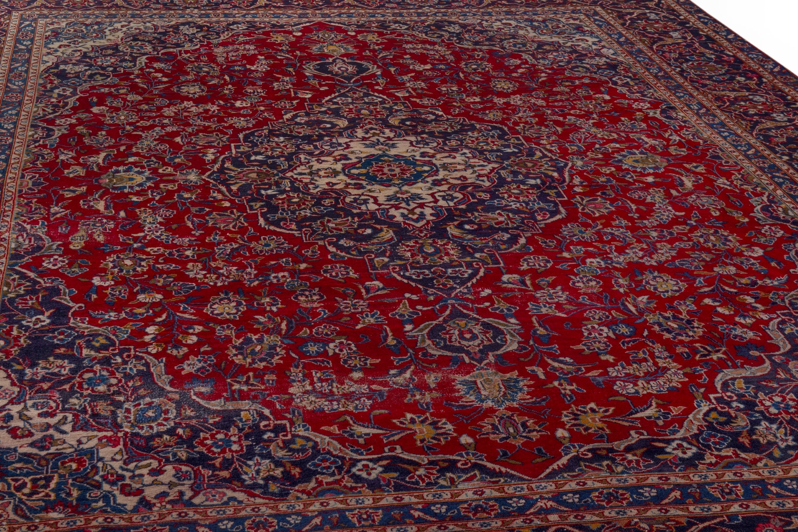 Persian Kashan oversized rug in deep red and dark blue, view 10 of 24