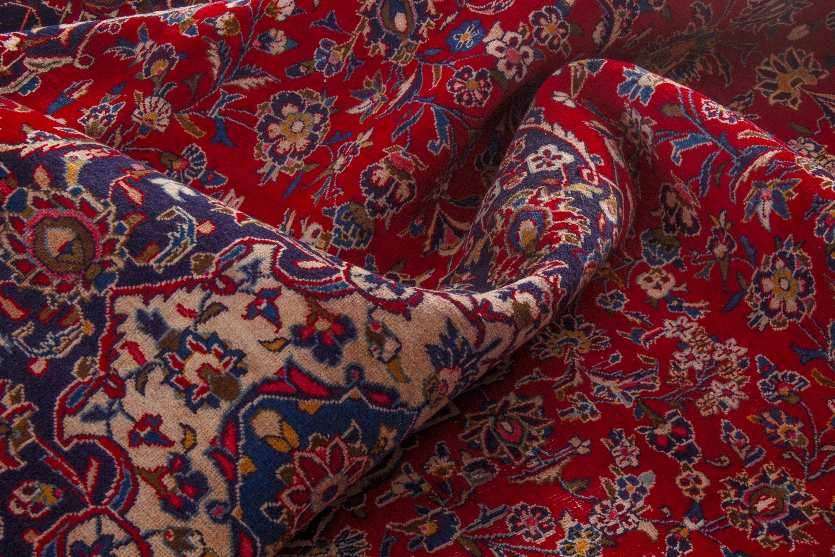 Persian Kashan oversized rug in deep red and dark blue, view 20 of 24