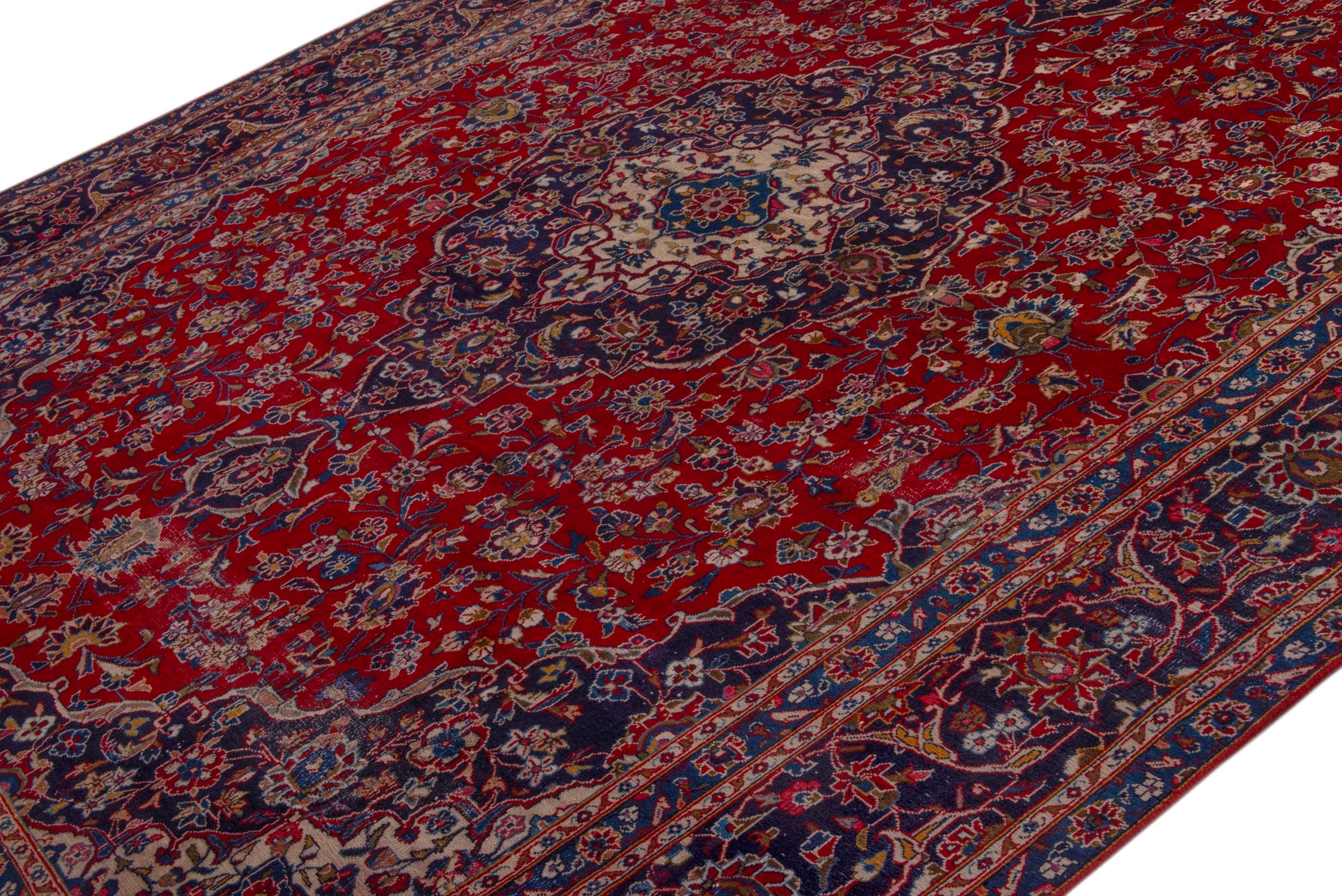 Persian Kashan oversized rug in deep red and dark blue, view 4 of 24