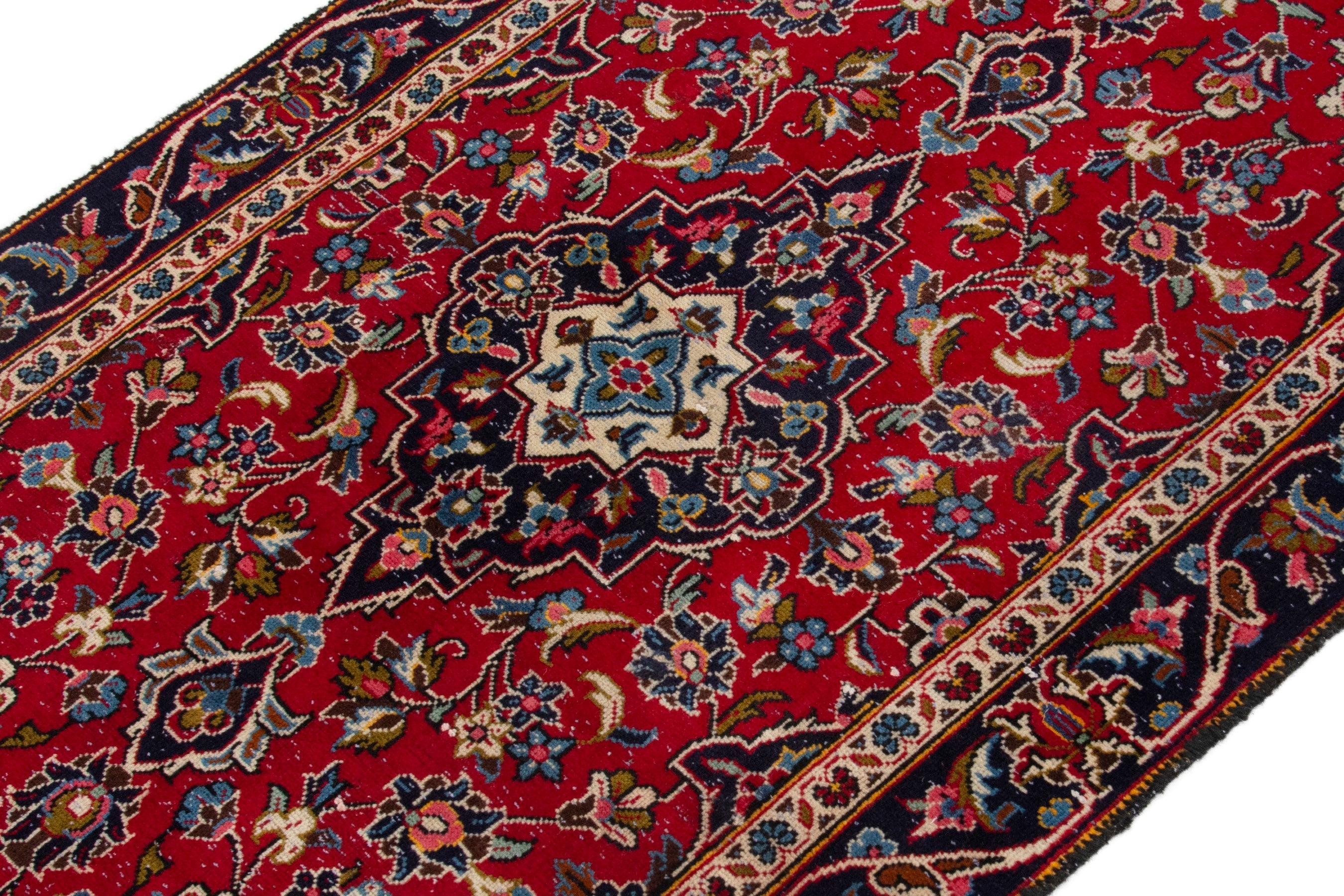 Persian Kashan accent rug in deep red and navy, view 4 of 17