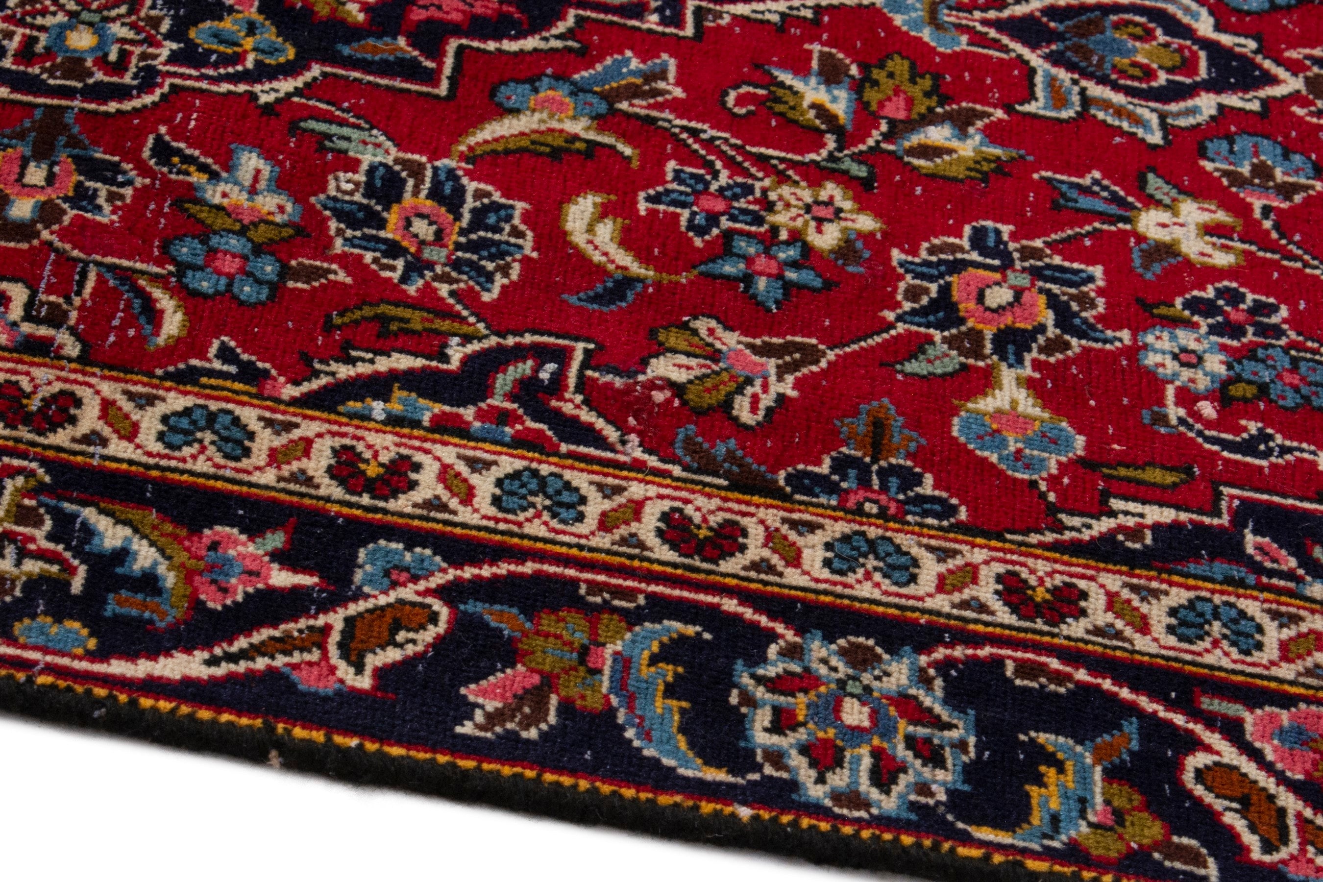 Persian Kashan accent rug in deep red and navy, view 8 of 17