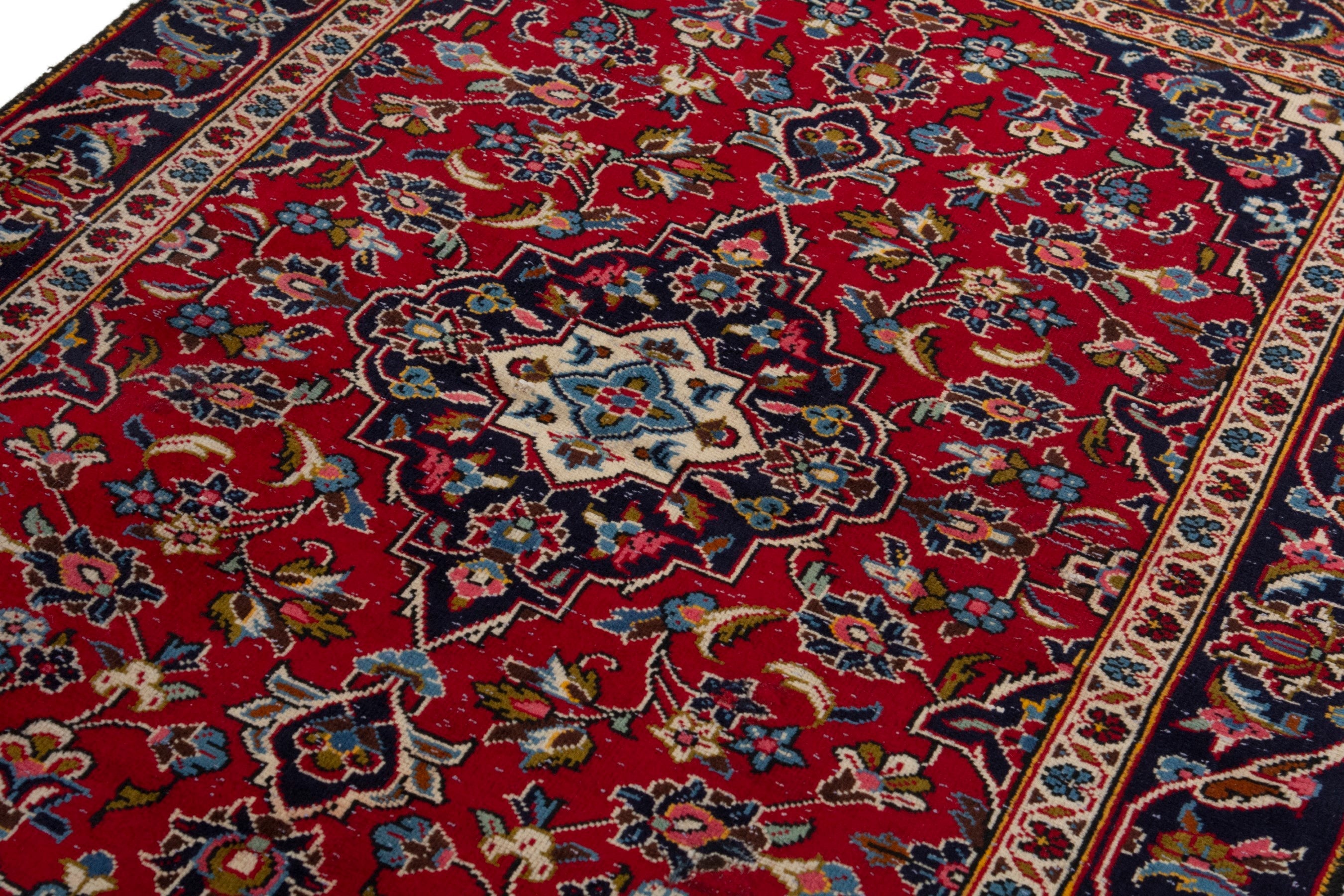 Persian Kashan accent rug in deep red and navy, view 9 of 17
