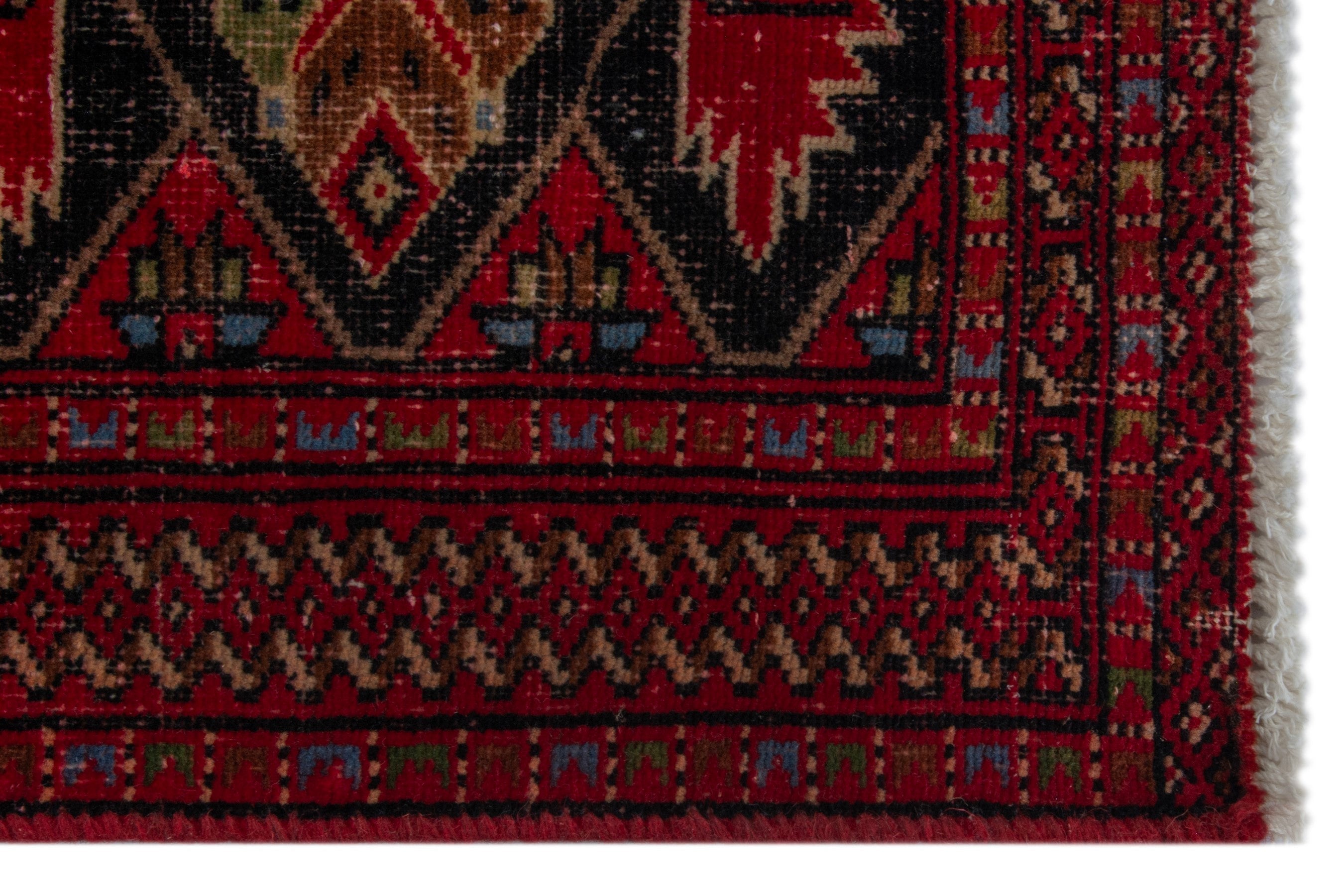 Persian Torkaman accent rug in deep red and burgundy, view 5 of 17