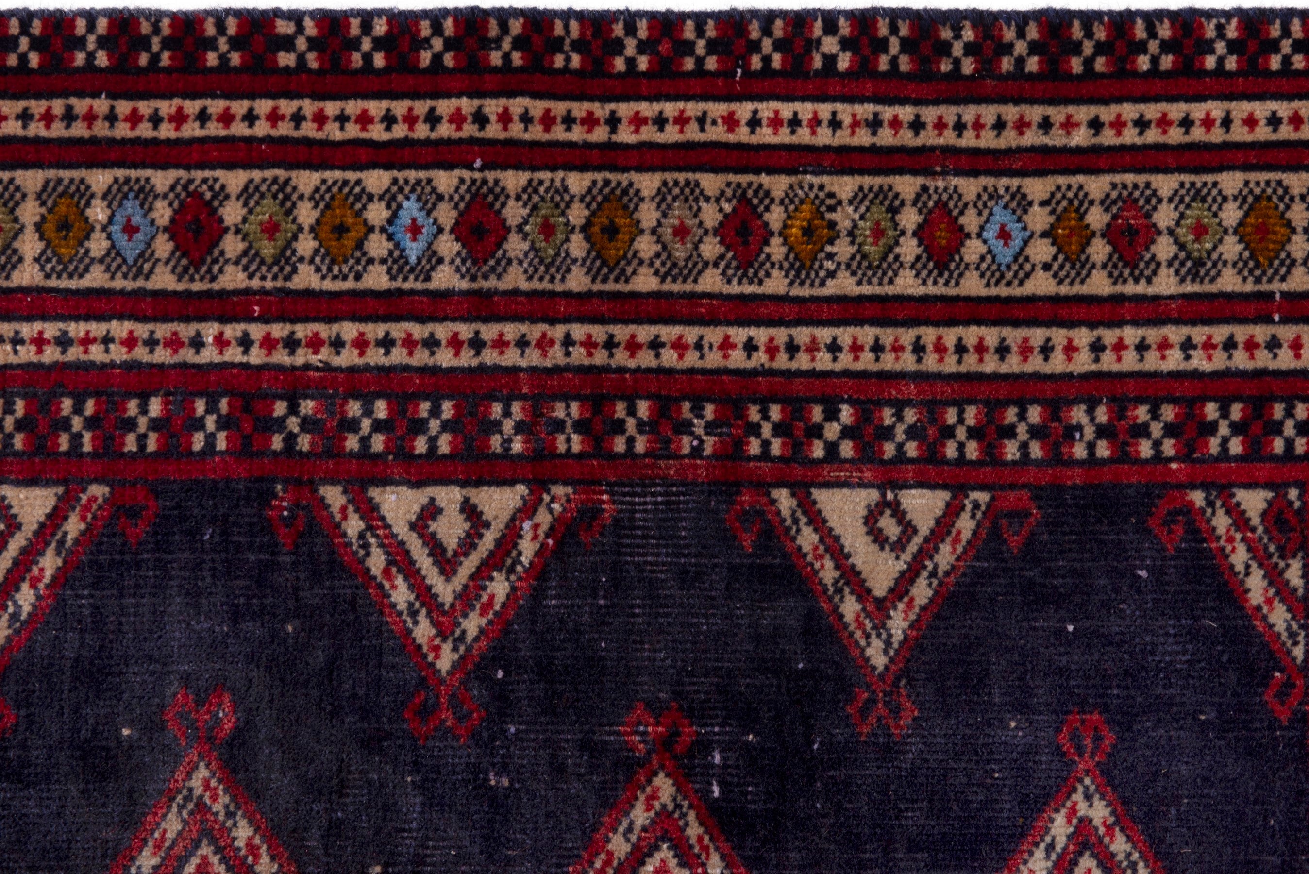 Persian Torkaman accent rug in navy and deep red, view 12 of 17