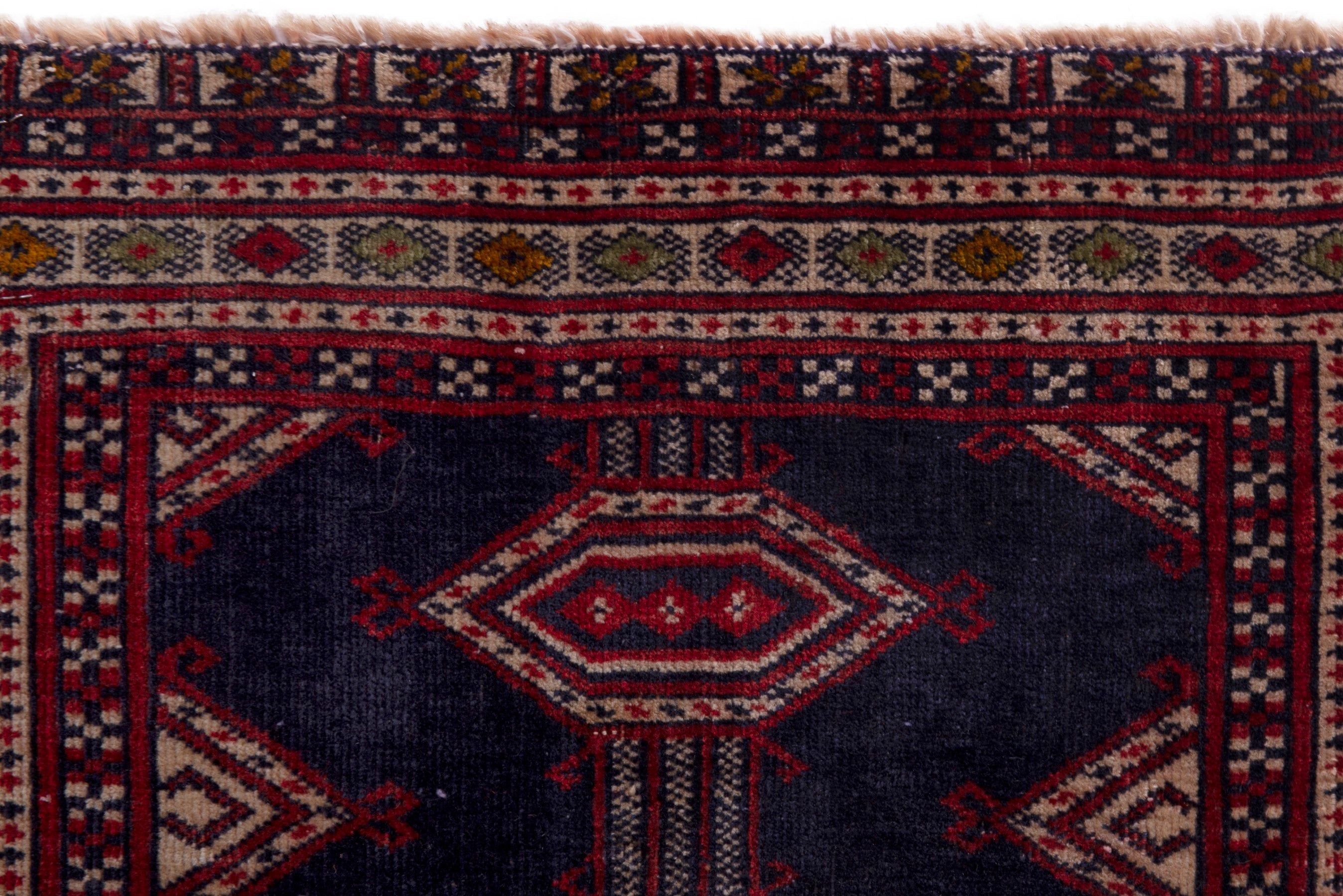 Persian Torkaman accent rug in navy and deep red, view 13 of 17