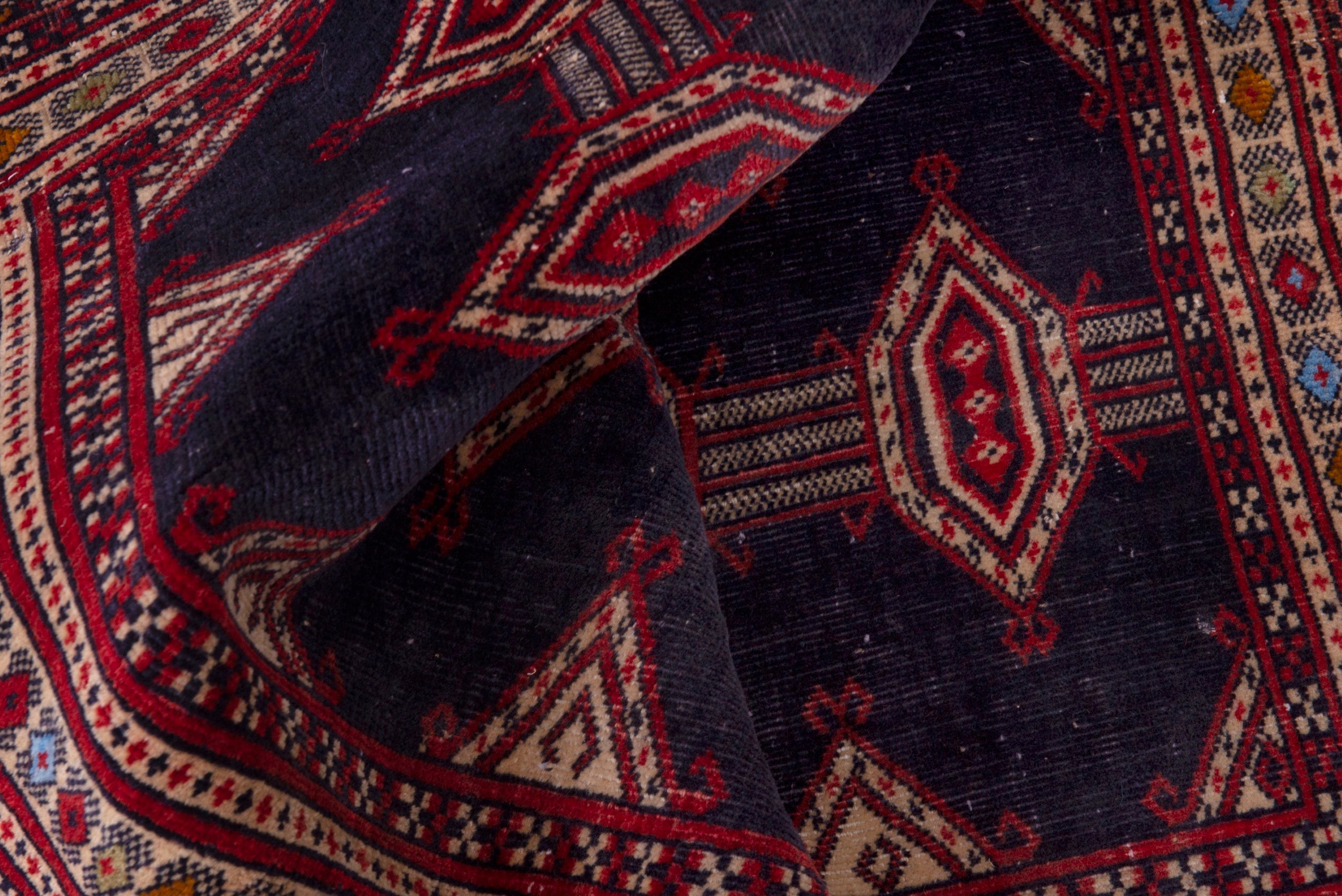 Persian Torkaman accent rug in navy and deep red, view 15 of 17