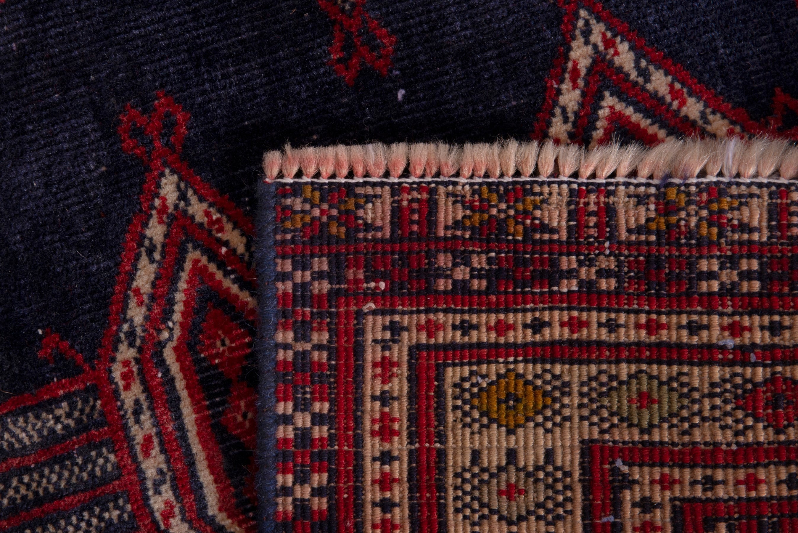 Persian Torkaman accent rug in navy and deep red, view 17 of 17
