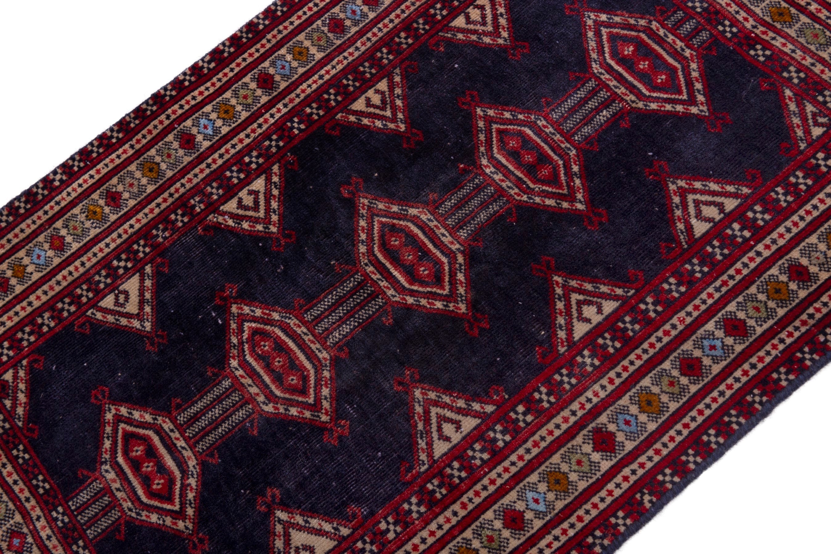 Persian Torkaman accent rug in navy and deep red, view 4 of 17