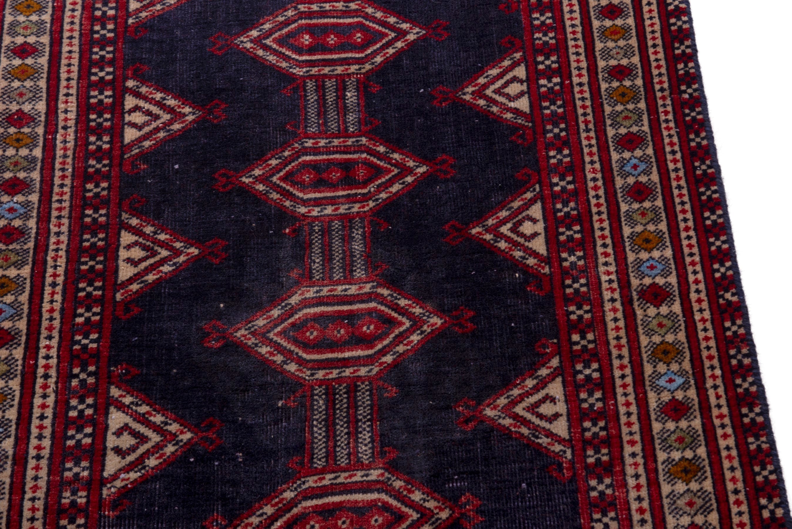Persian Torkaman accent rug in navy and deep red, view 7 of 17