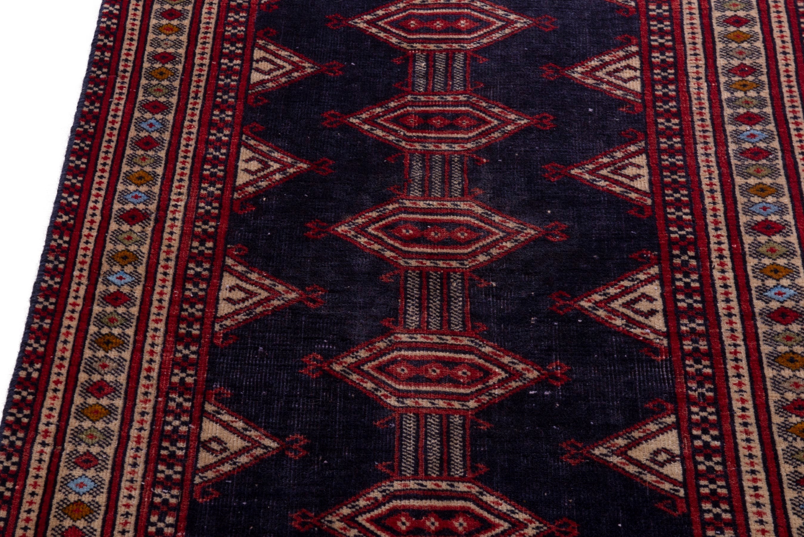 Persian Torkaman accent rug in navy and deep red, view 9 of 17