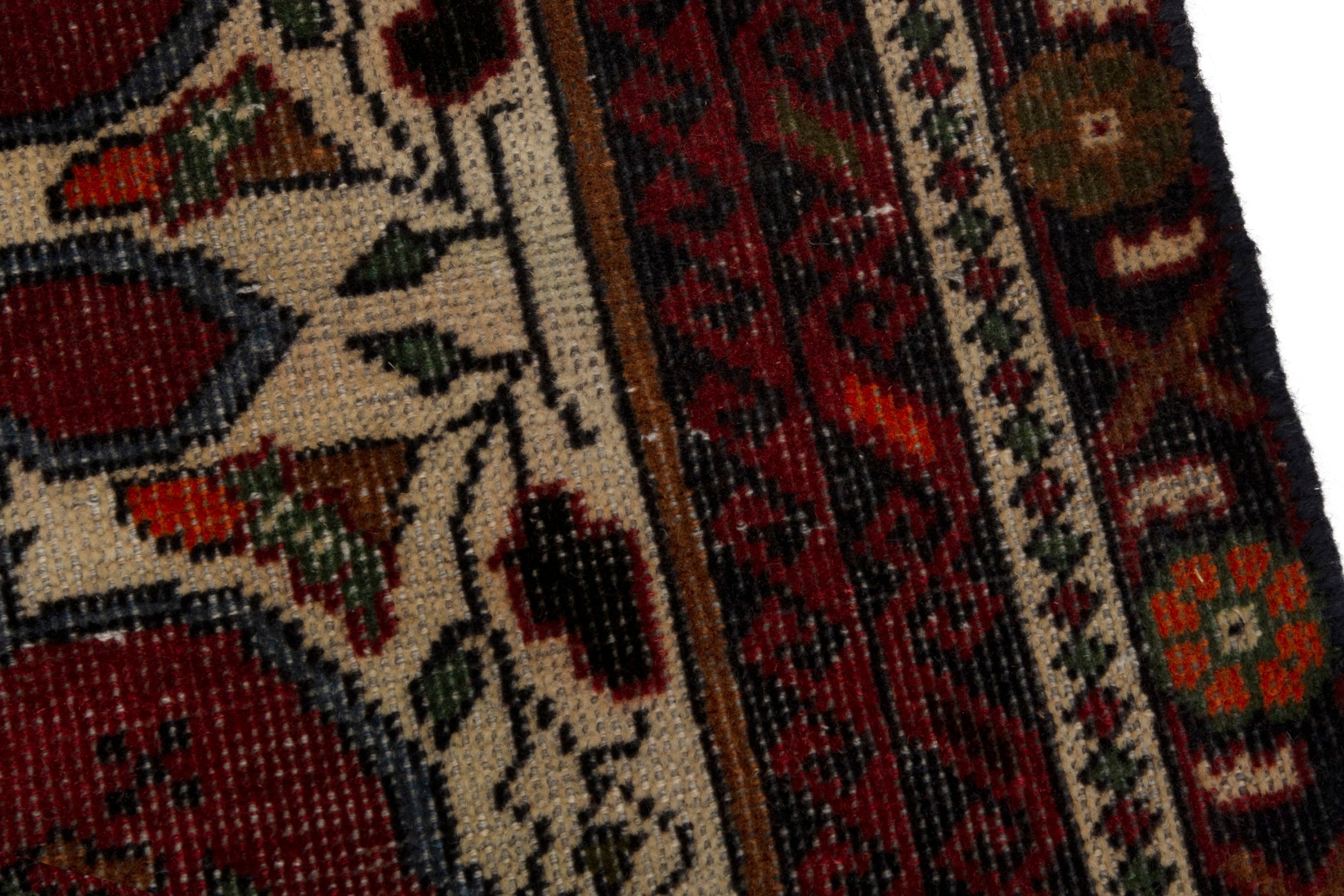 Persian Baluch accent rug in deep red and cream, view 7 of 18