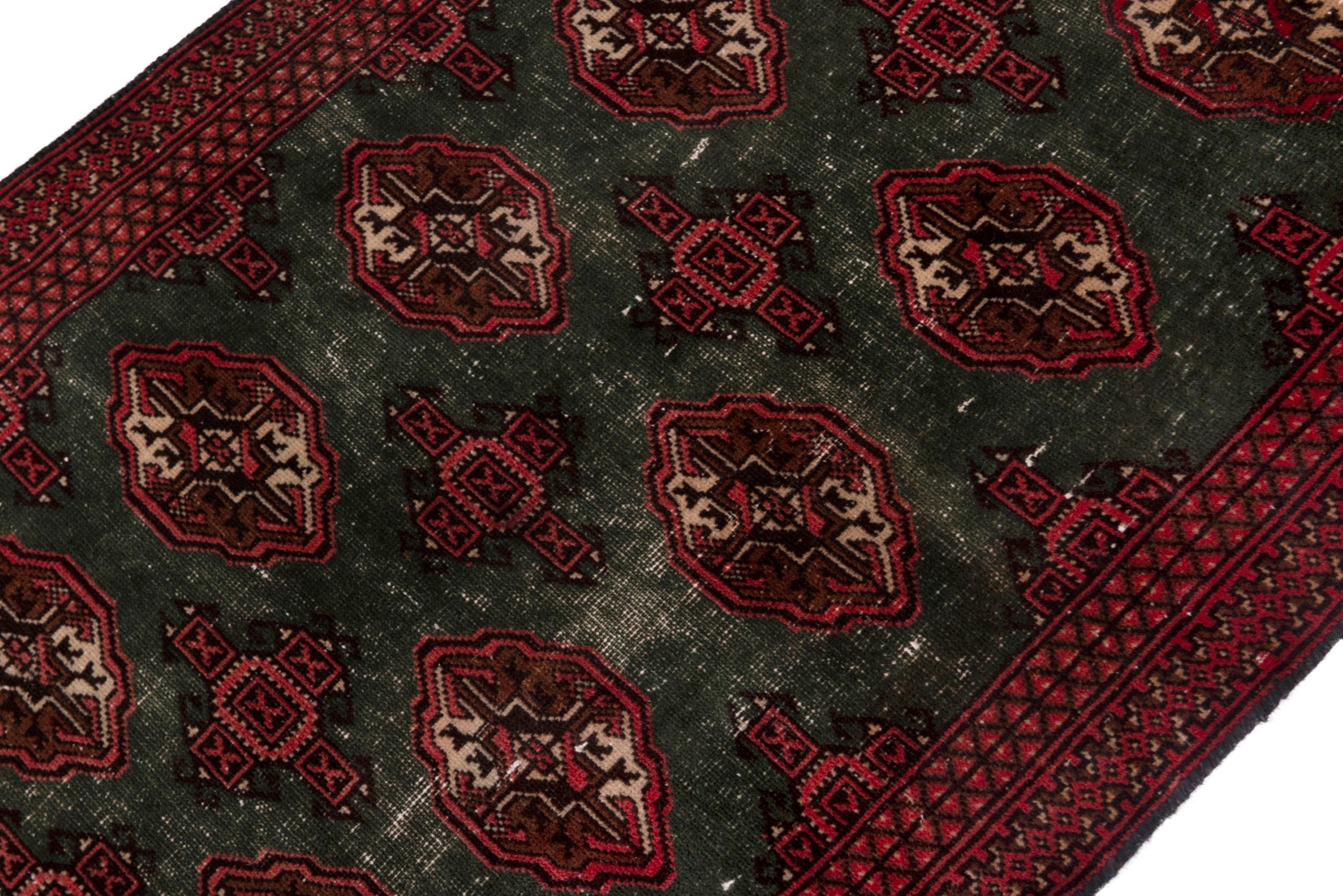Persian Torkaman accent rug in forest and burgundy, view 4 of 18