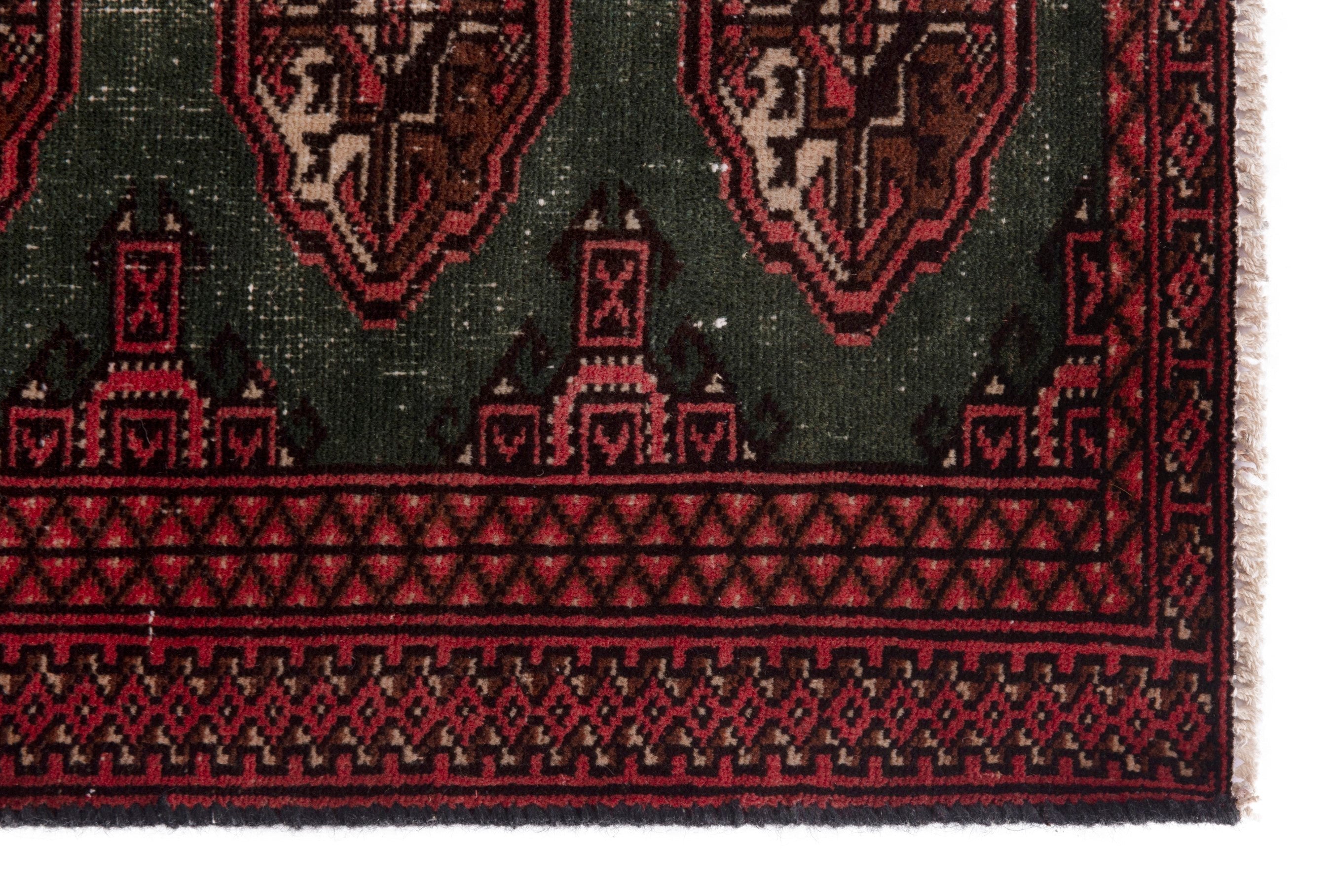 Persian Torkaman accent rug in forest and burgundy, view 5 of 18