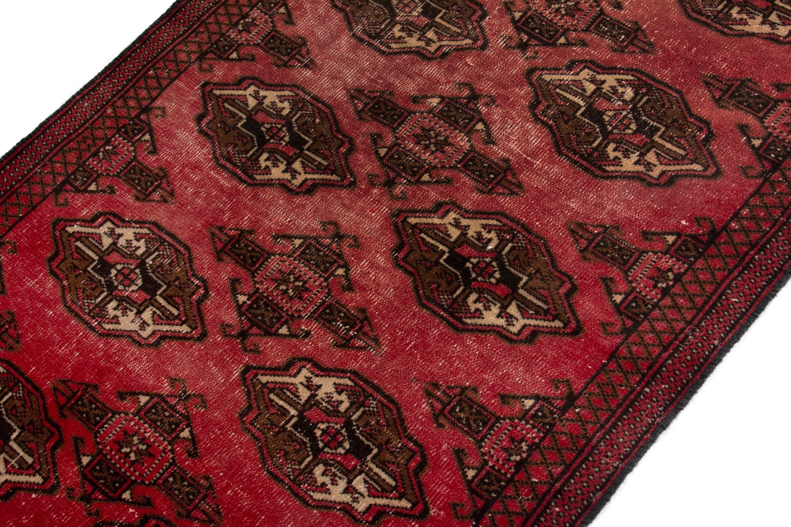 Persian Torkaman accent rug in deep red and dark brown, view 4 of 17