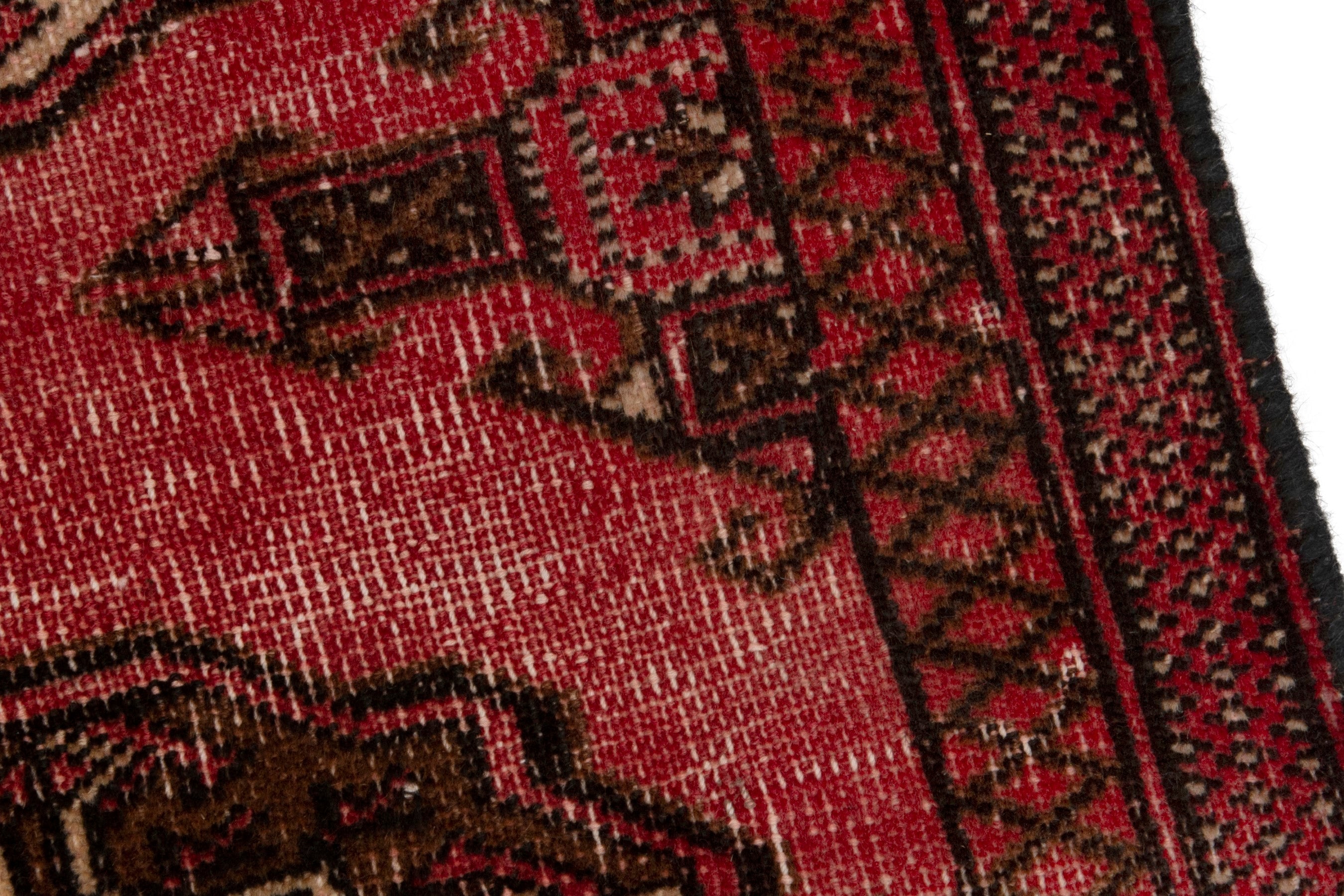 Persian Torkaman accent rug in deep red and dark brown, view 7 of 17