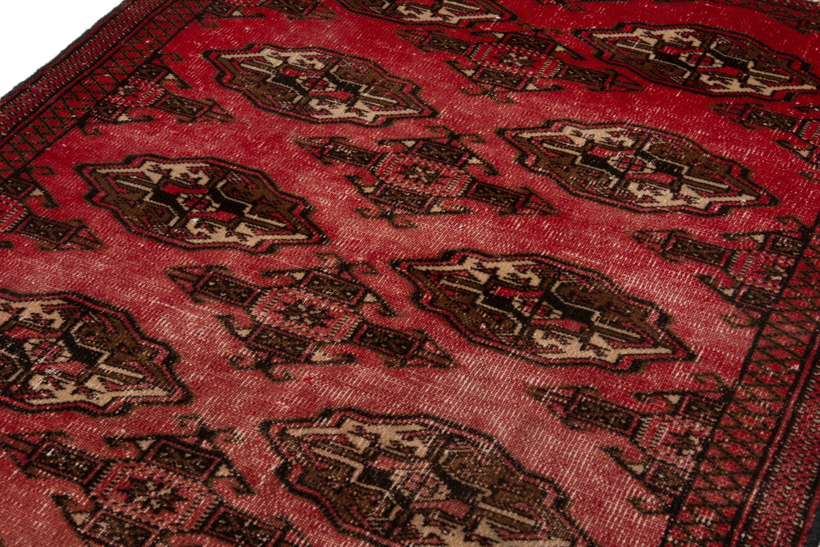 Persian Torkaman accent rug in deep red and dark brown, view 9 of 17