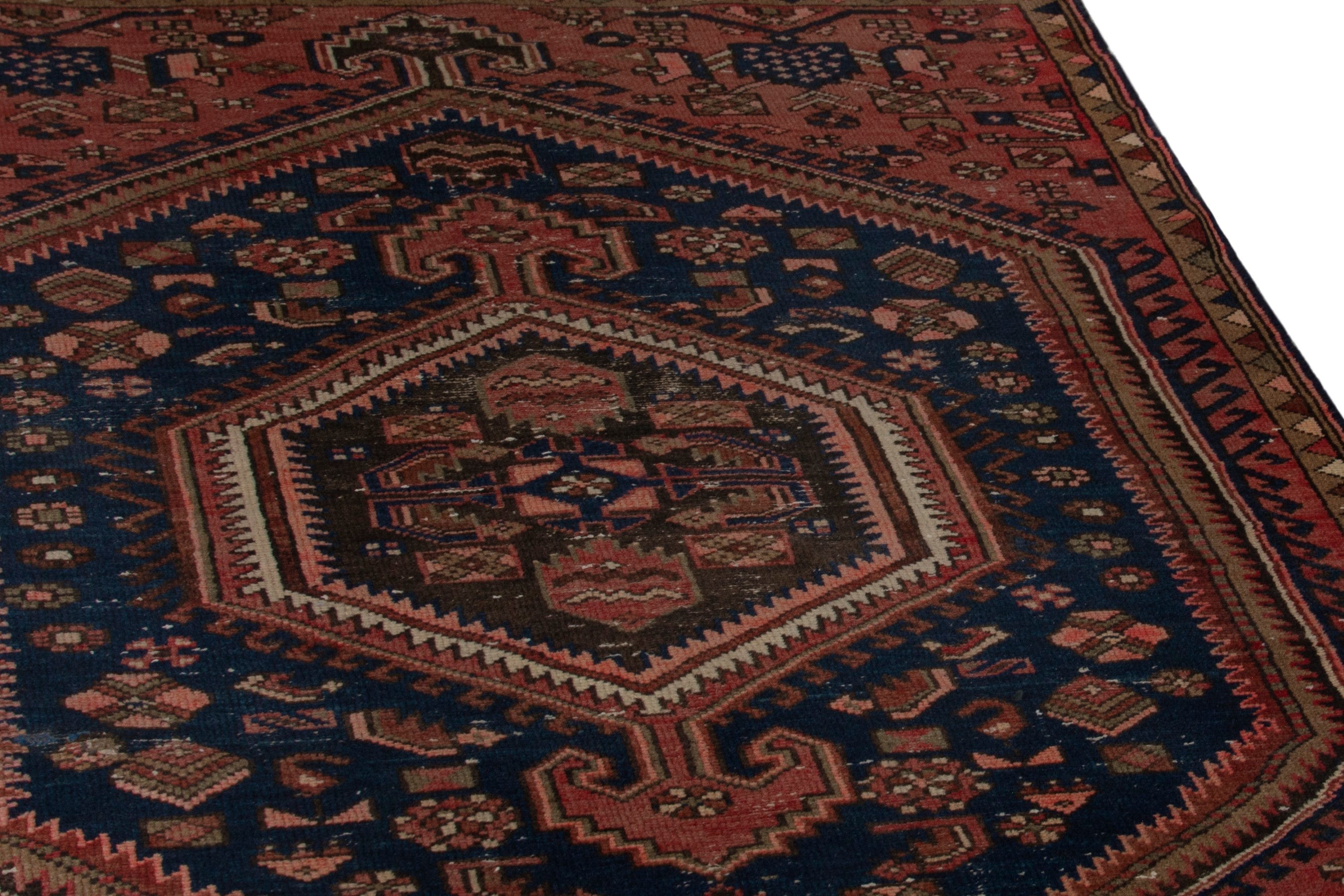 Persian Zanjan accent rug in rust and navy, view 10 of 18