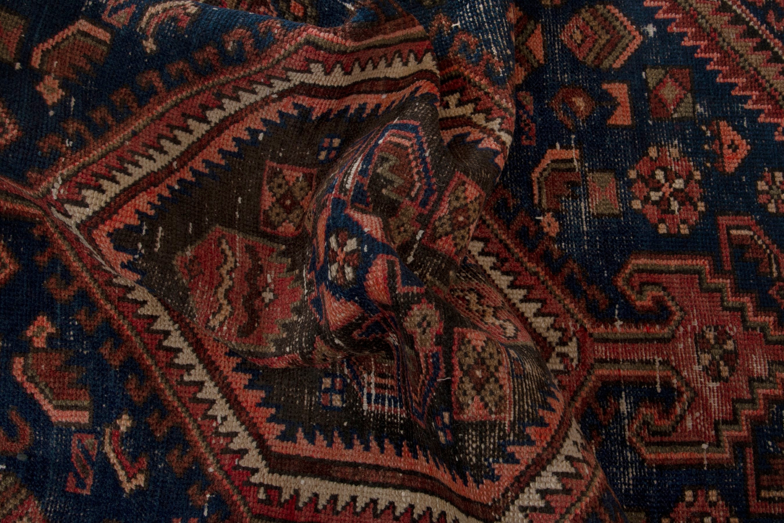 Persian Zanjan accent rug in rust and navy, view 17 of 18