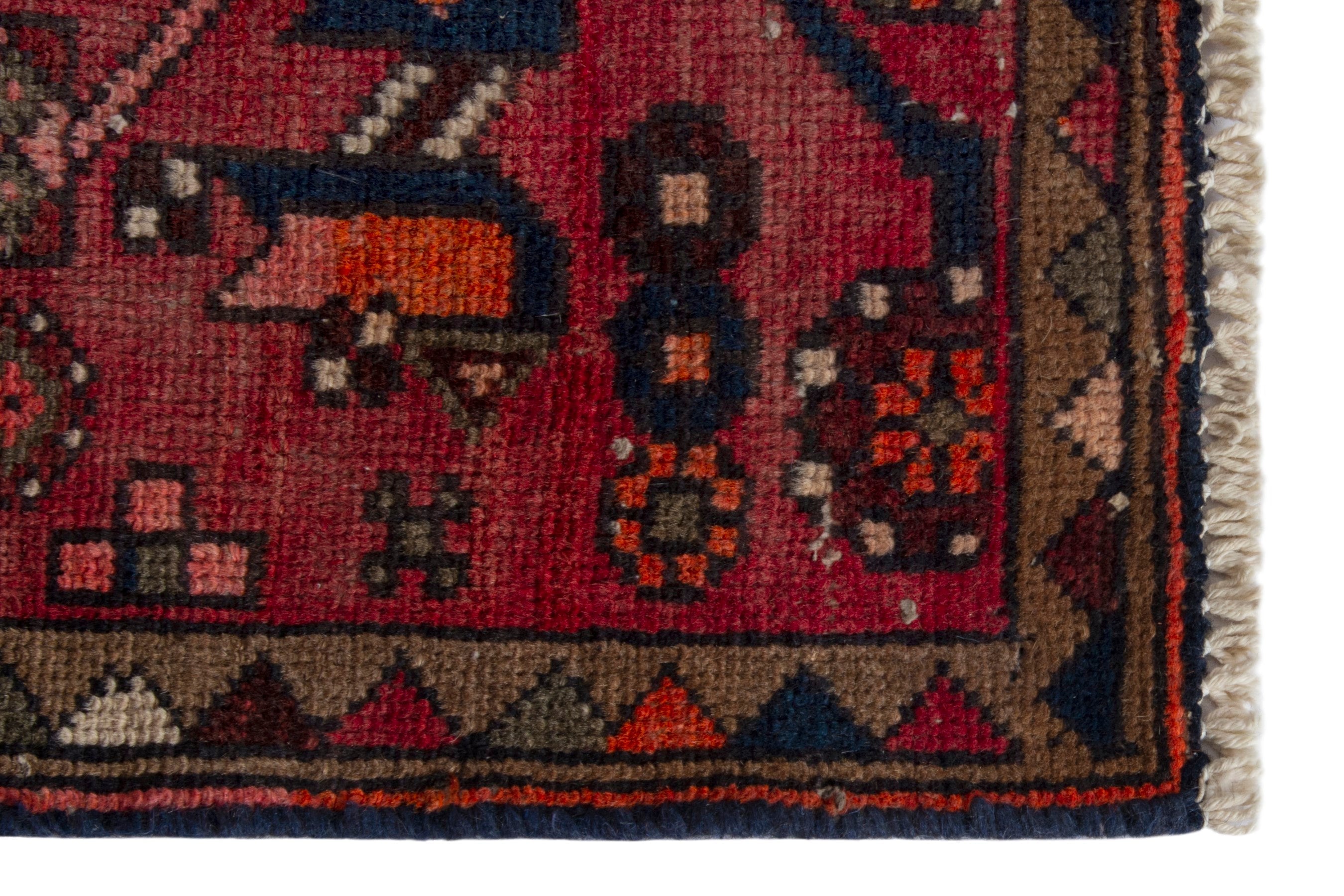 Persian Zanjan accent rug in rust and navy, view 5 of 18