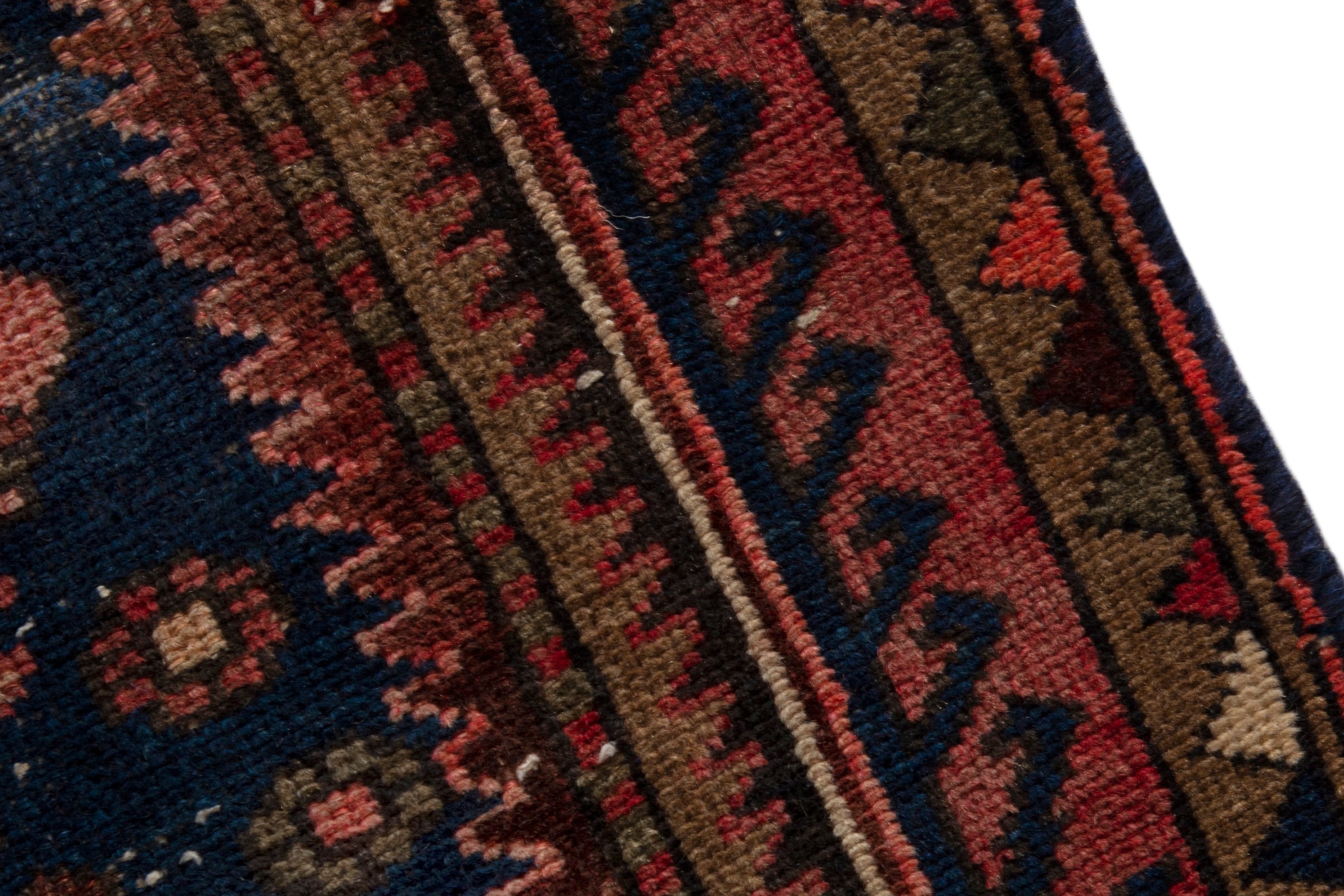 Persian Zanjan accent rug in rust and navy, view 7 of 18
