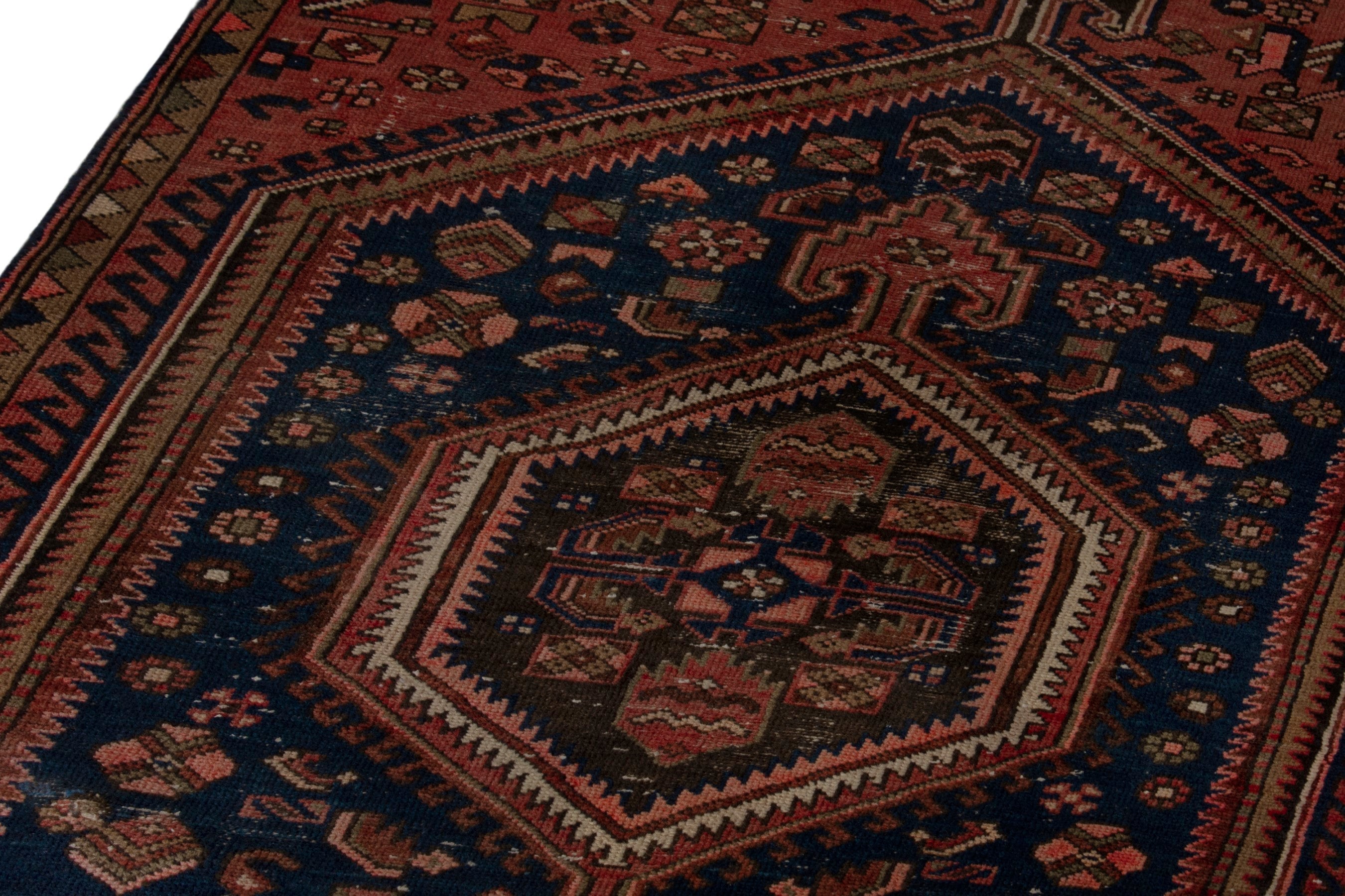 Persian Zanjan accent rug in rust and navy, view 9 of 18