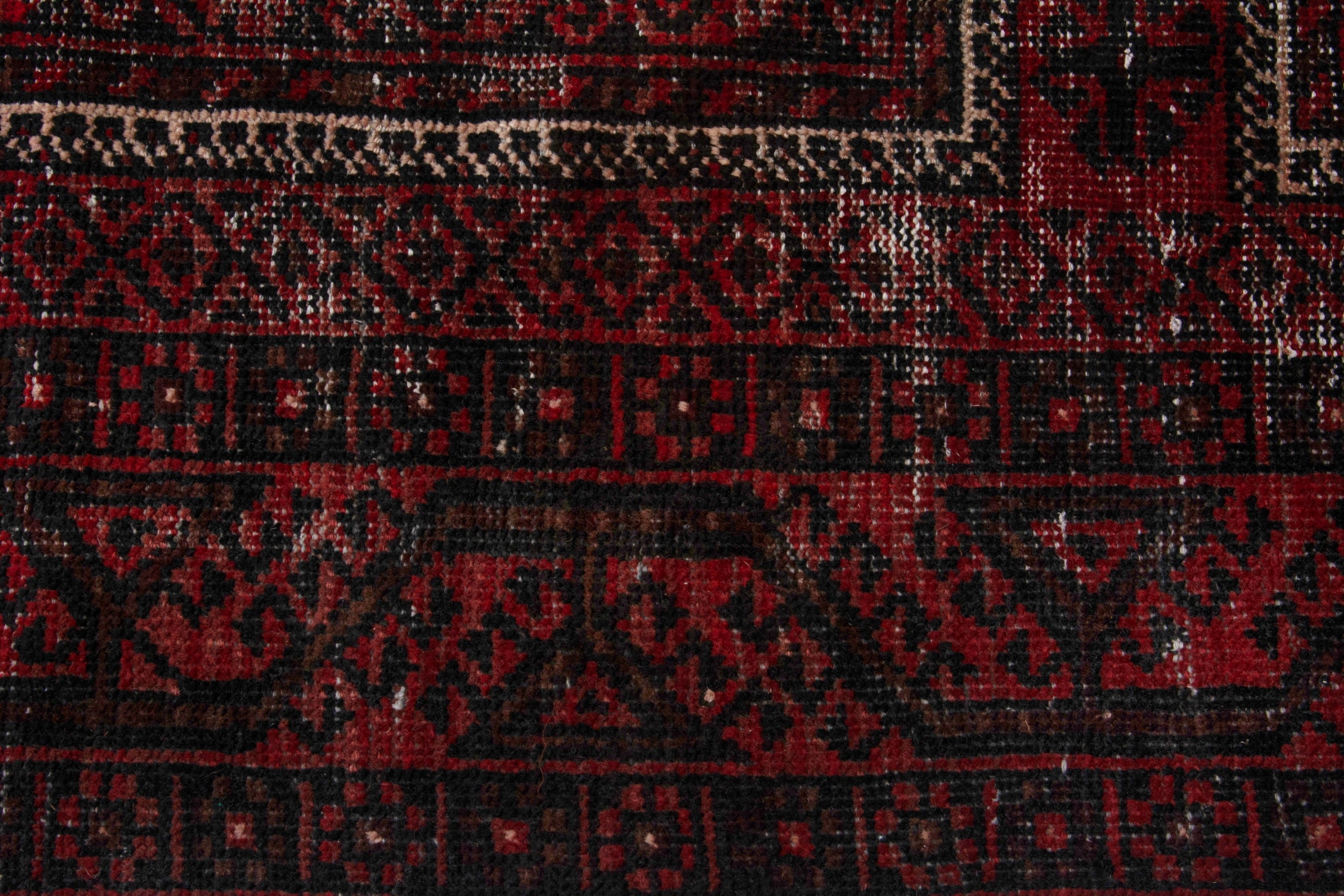 Persian Baluch runner rug in deep red and faded red, view 13 of 18
