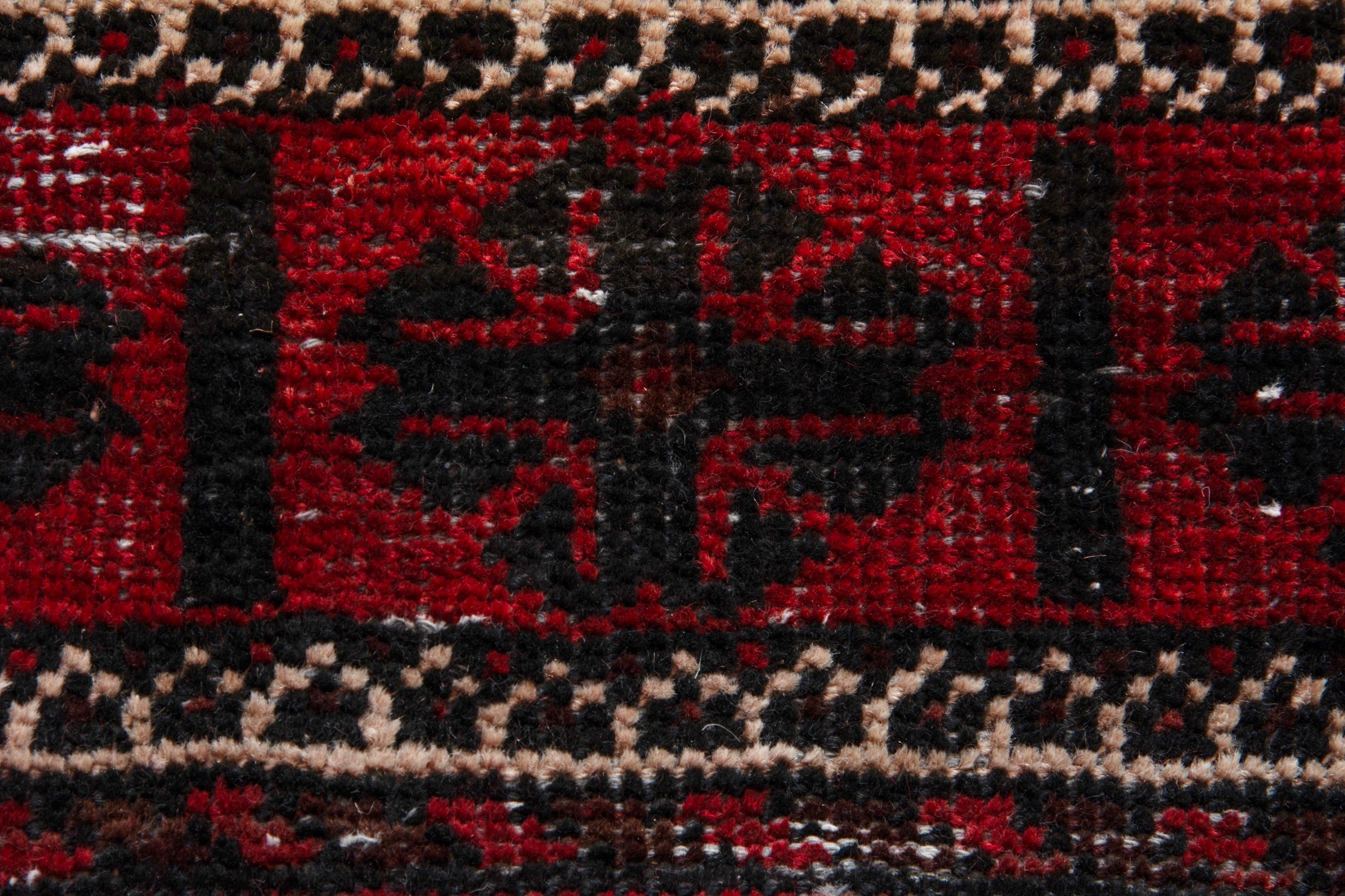 Persian Baluch runner rug in deep red and faded red, view 14 of 18