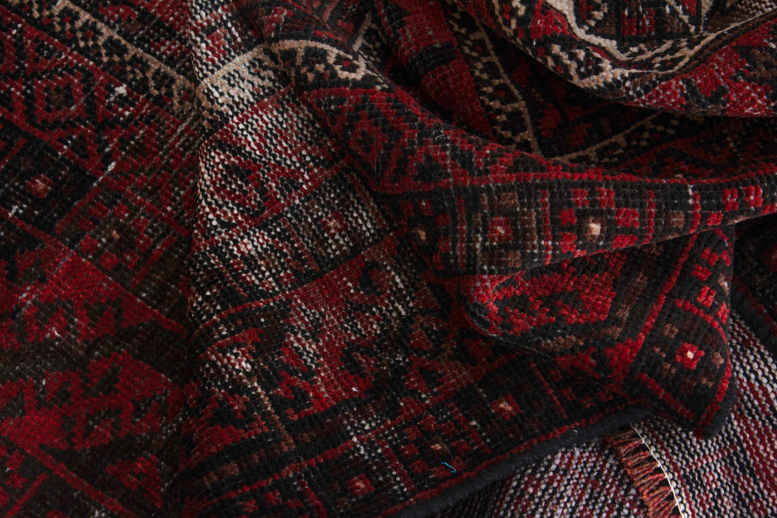 Persian Baluch runner rug in deep red and faded red, view 15 of 18